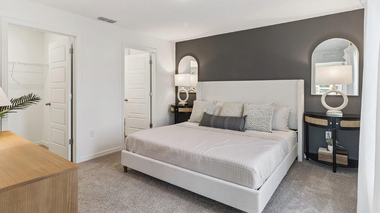 Primary bedroom with carpet flooring