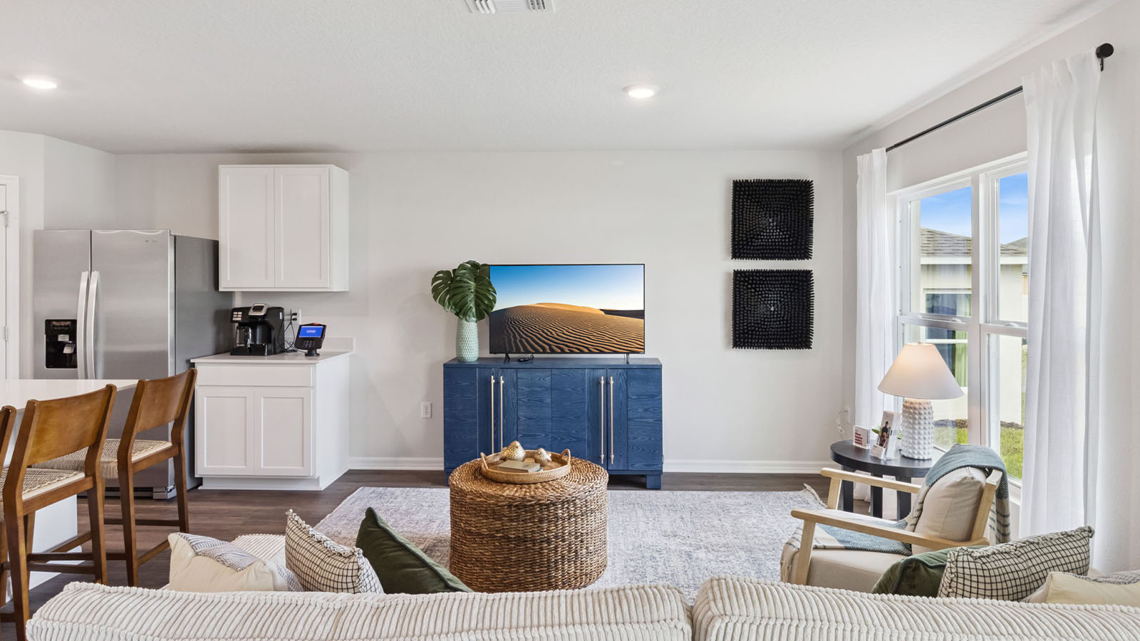Kitchen with large island and view to second hallway