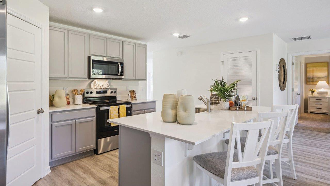 Kitchen island overlooking living room and dining room