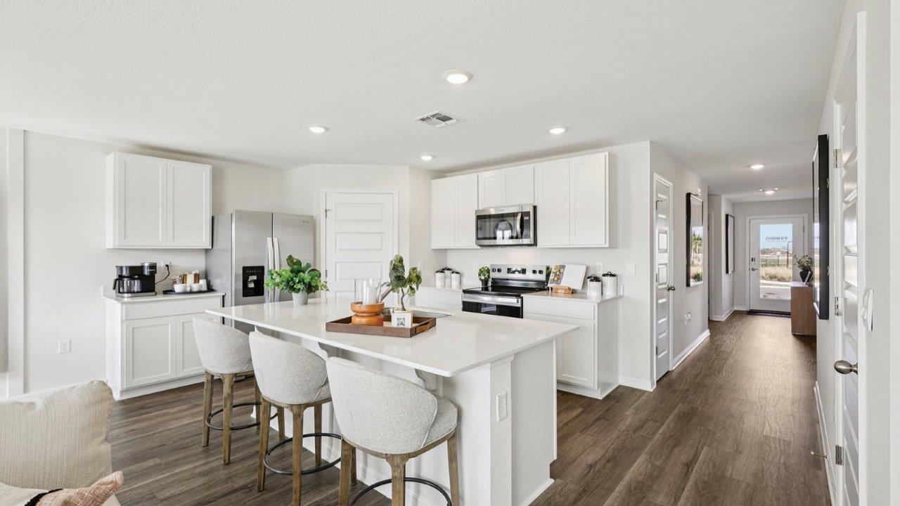 Kitchen with cabinets and bar seating