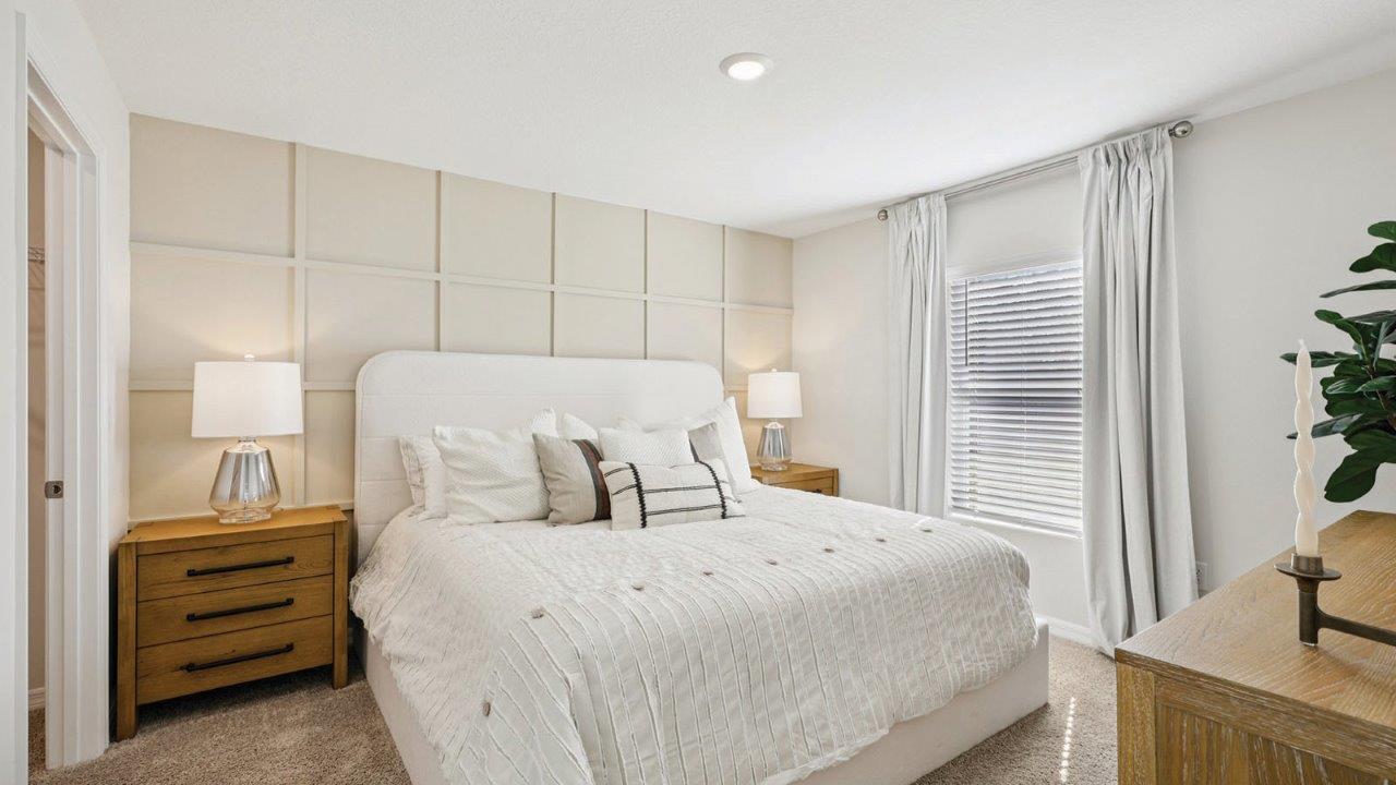 Primary bedroom with king size bed and two night stands