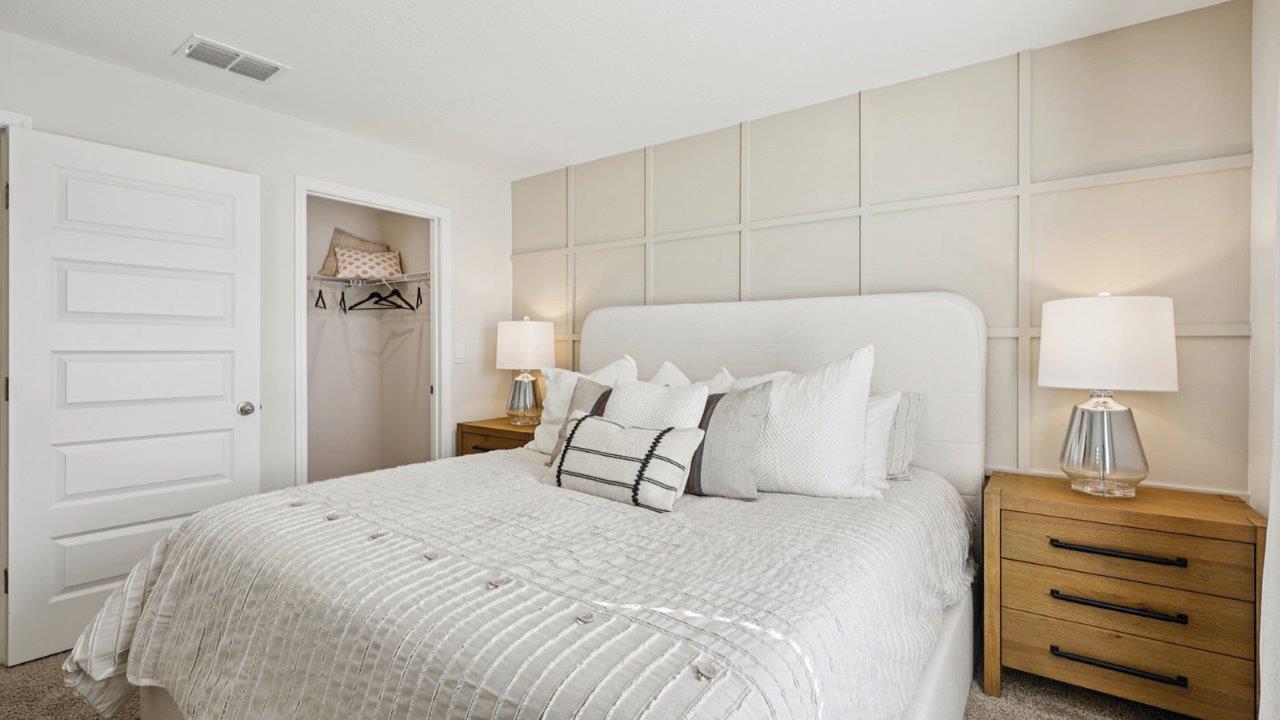 Primary bedroom walk in closet