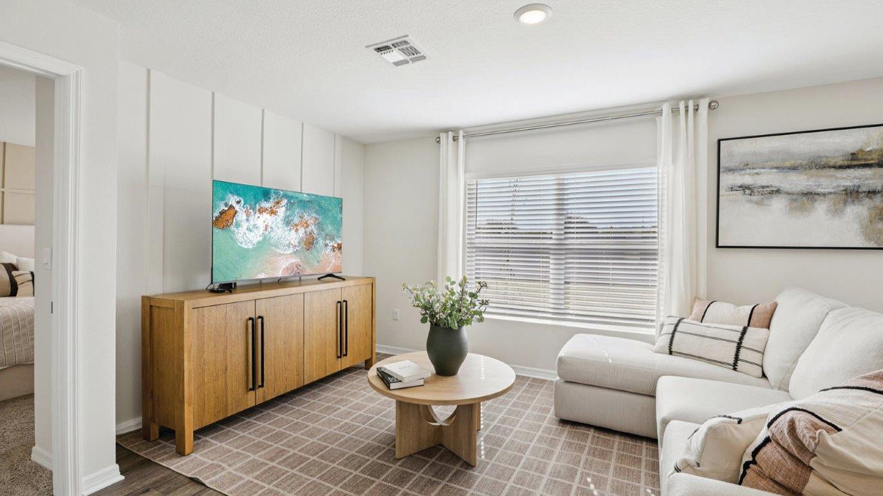 Living room with couch, coffee table and TV