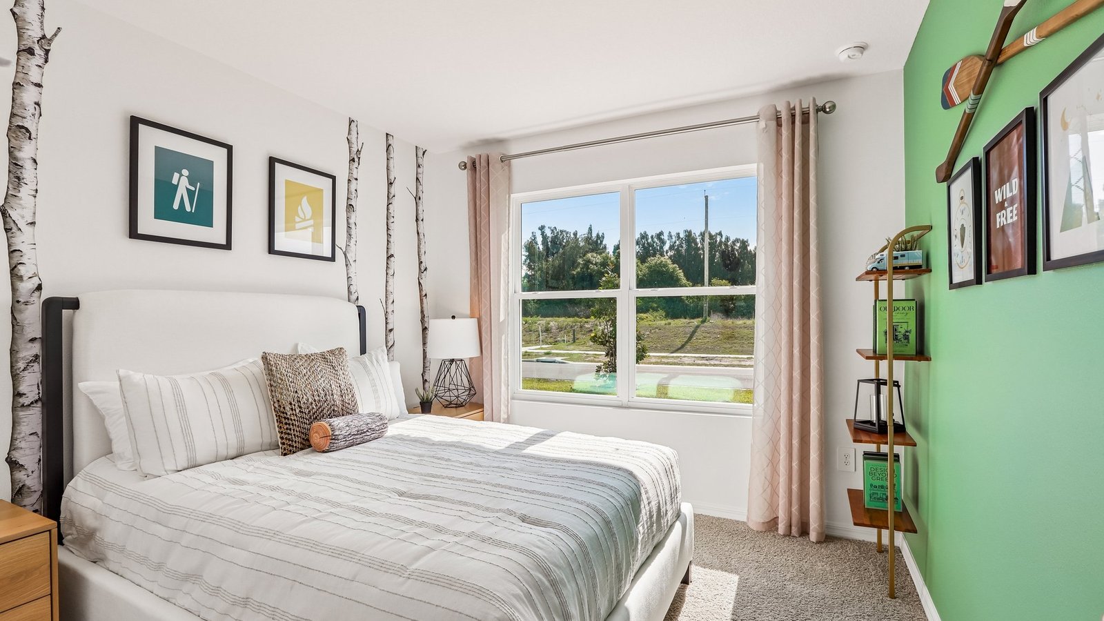 Guest bedroom with bed, nightstands and a roomy closet for storage.