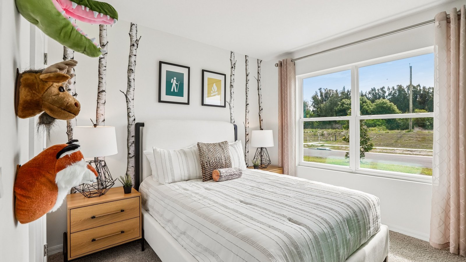 Guest bedroom with bed, nightstands and a roomy closet for storage.