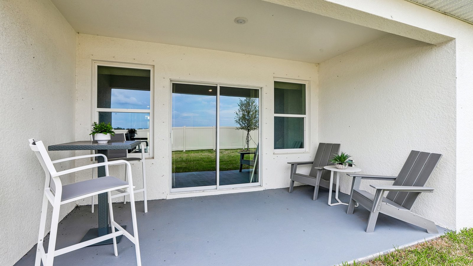 Home backyard with covered lanai, and room for entertaining.
