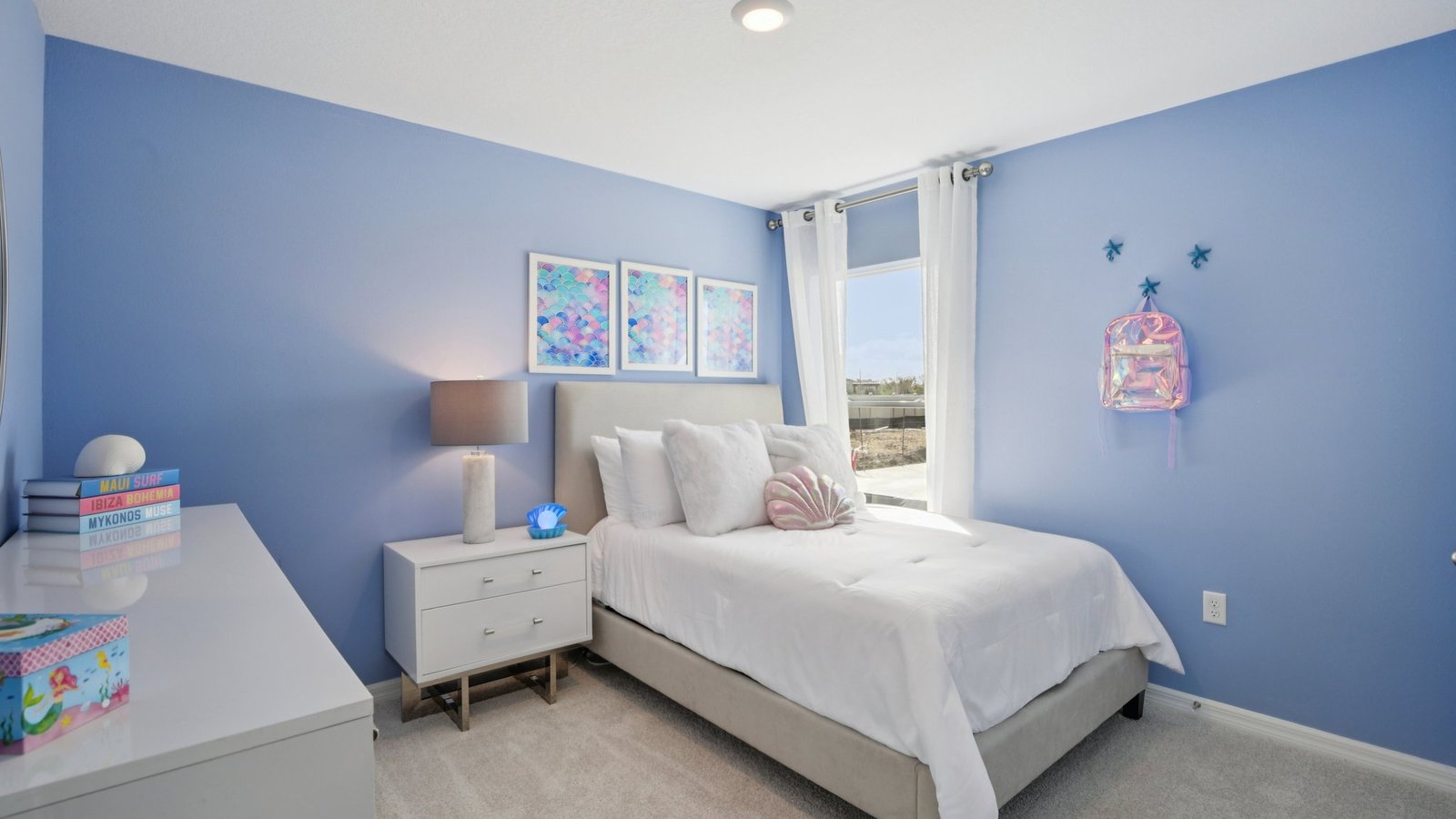 Guest bedroom with bed, nightstands and a roomy closet for storage.