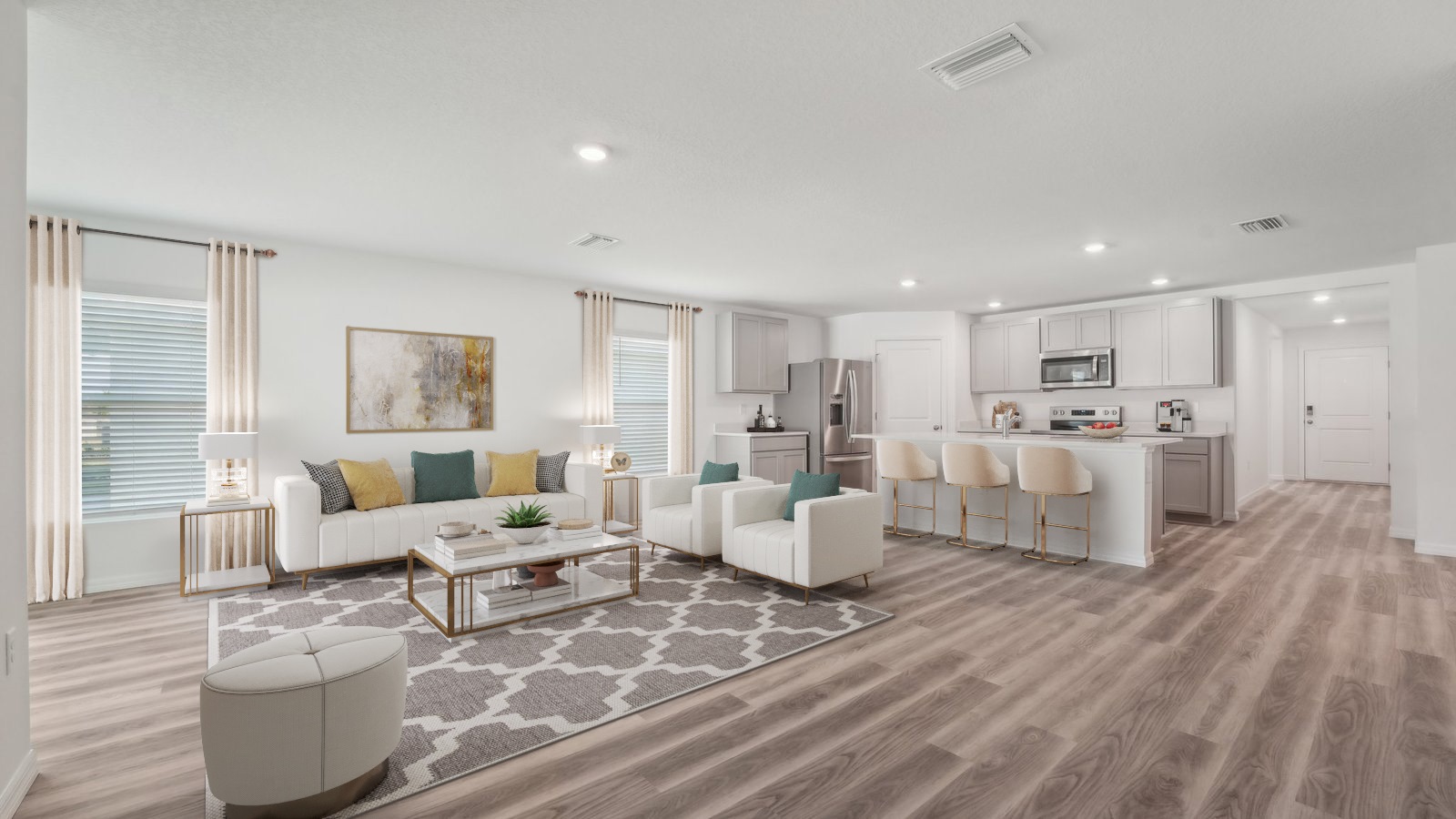 Open concept living area with couch seating and access to the backyard thru slider door.