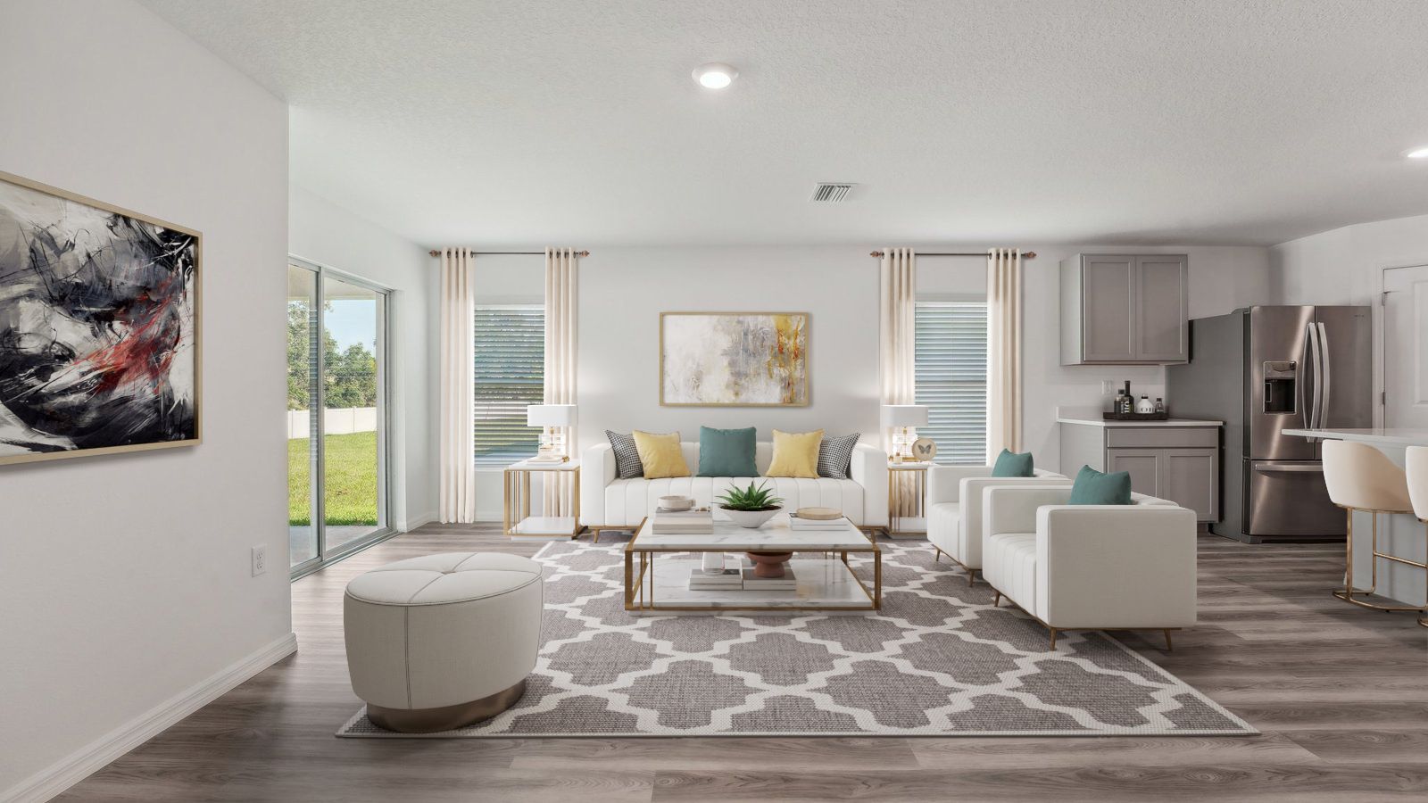 Open concept living area with couch seating and access to the backyard thru slider door.