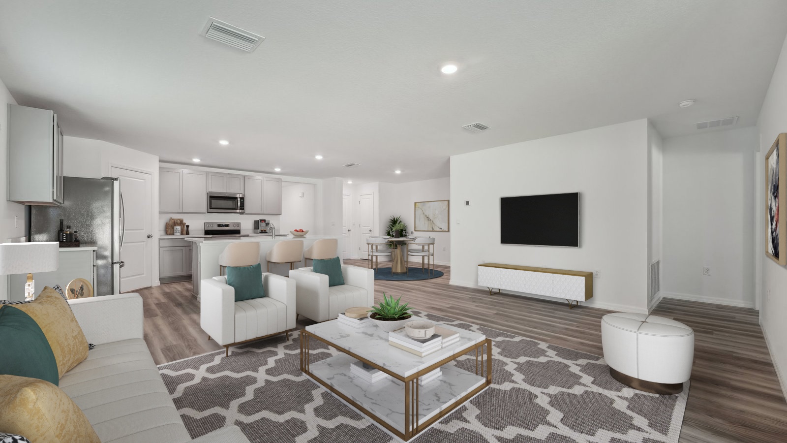 Open concept living area with couch seating and access to the backyard thru slider door.