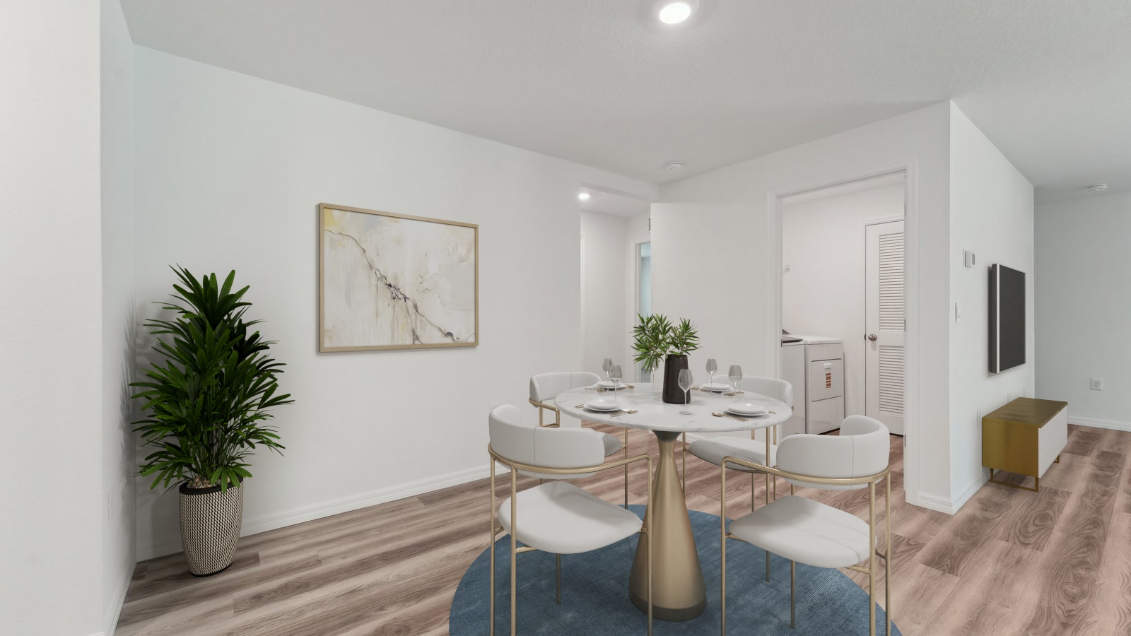 Dining room adjacent to the kitchen with table, chairs and LVP flooring.