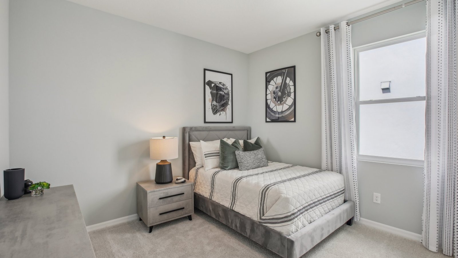 Guest bedroom with bed, nightstands and a roomy closet for storage.