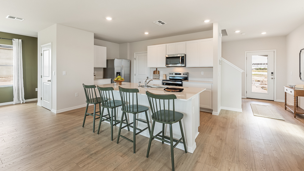 Kitchen in the Elston floorplan at Rye Crossing by D.R. Horton in Parrish Florida