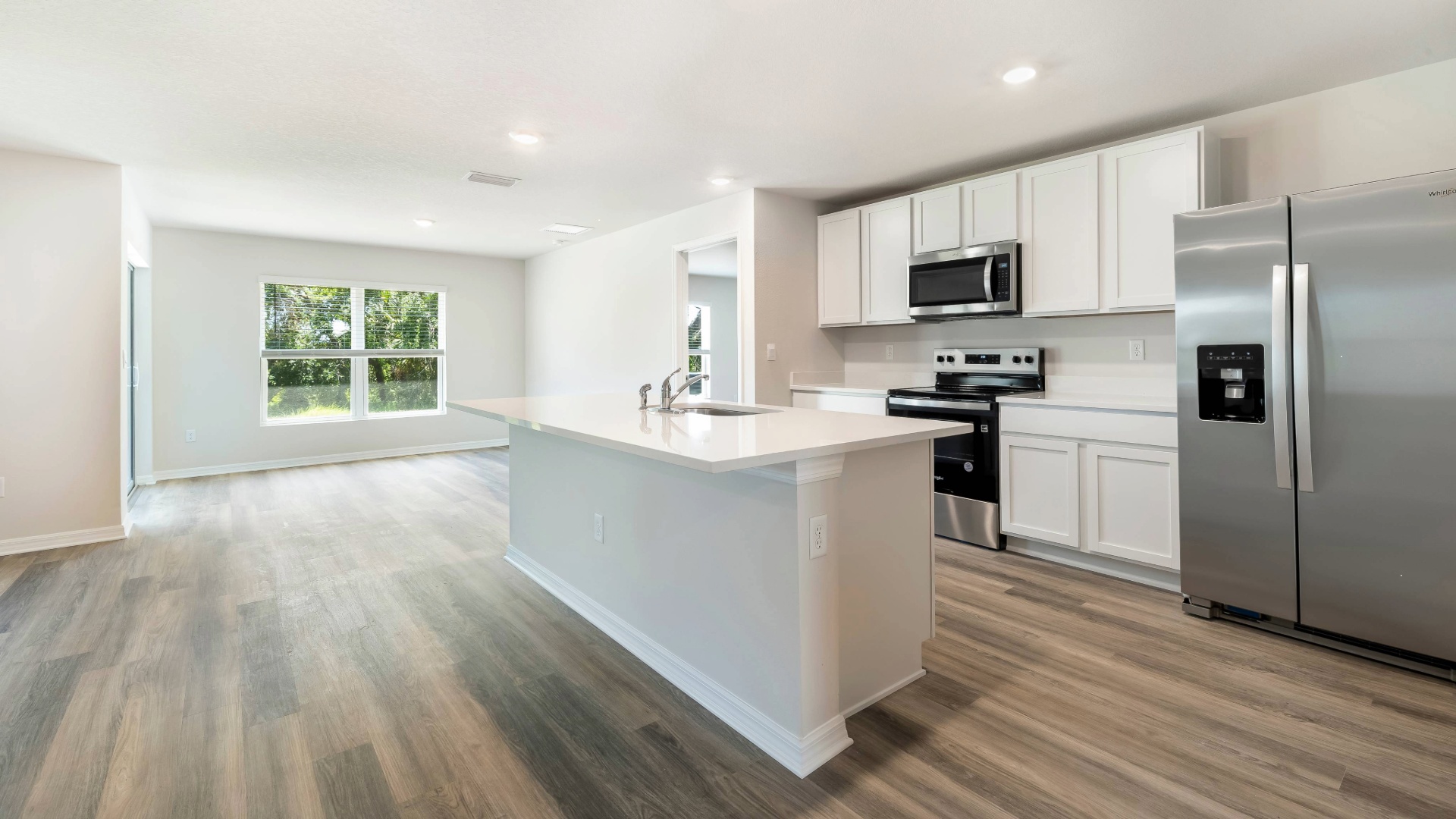 Kitchen in the Aria floorplan at Legacy Preserve by D.R. Horton in Parrish Florida