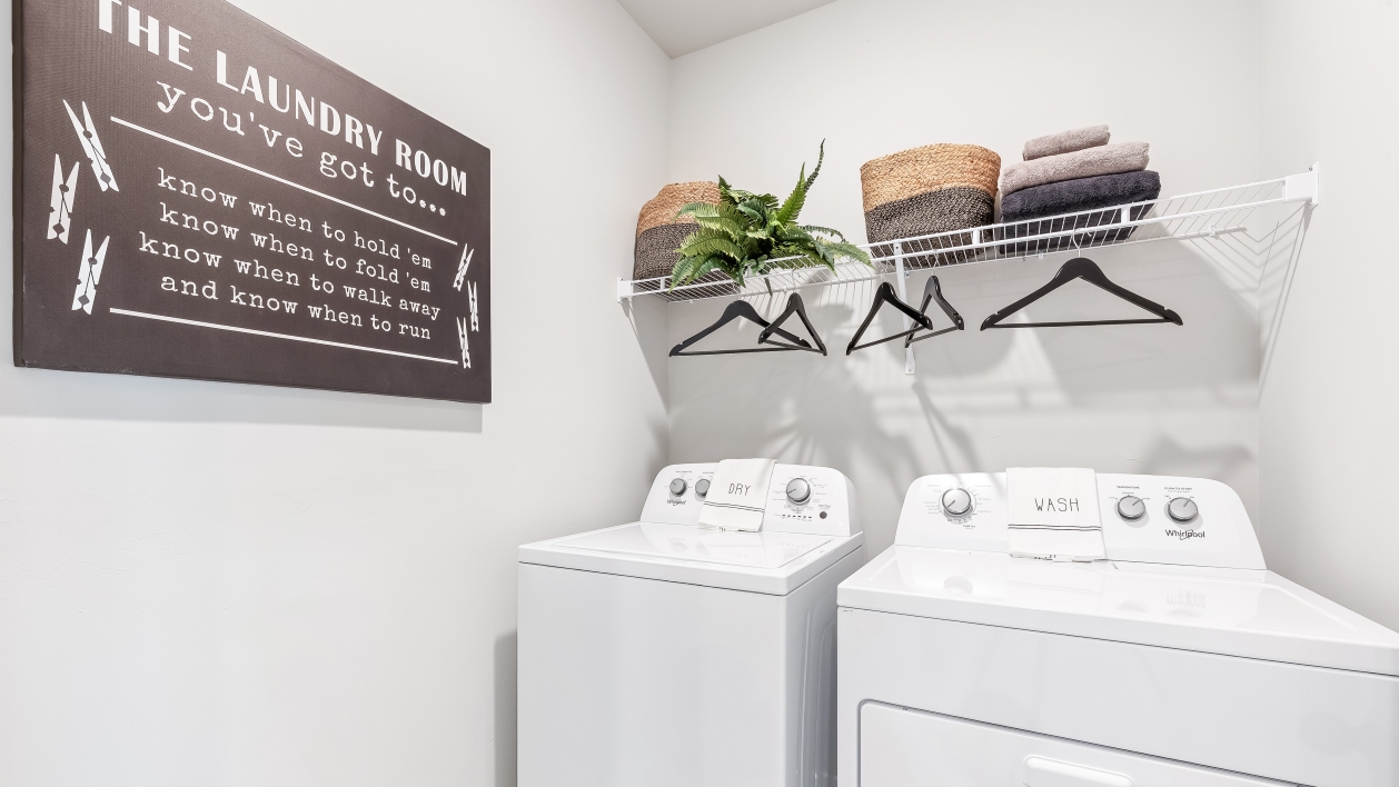 Laundry room in the Carrington floorplan at Legacy Preserve by D.R. Horton in Parrish Florida