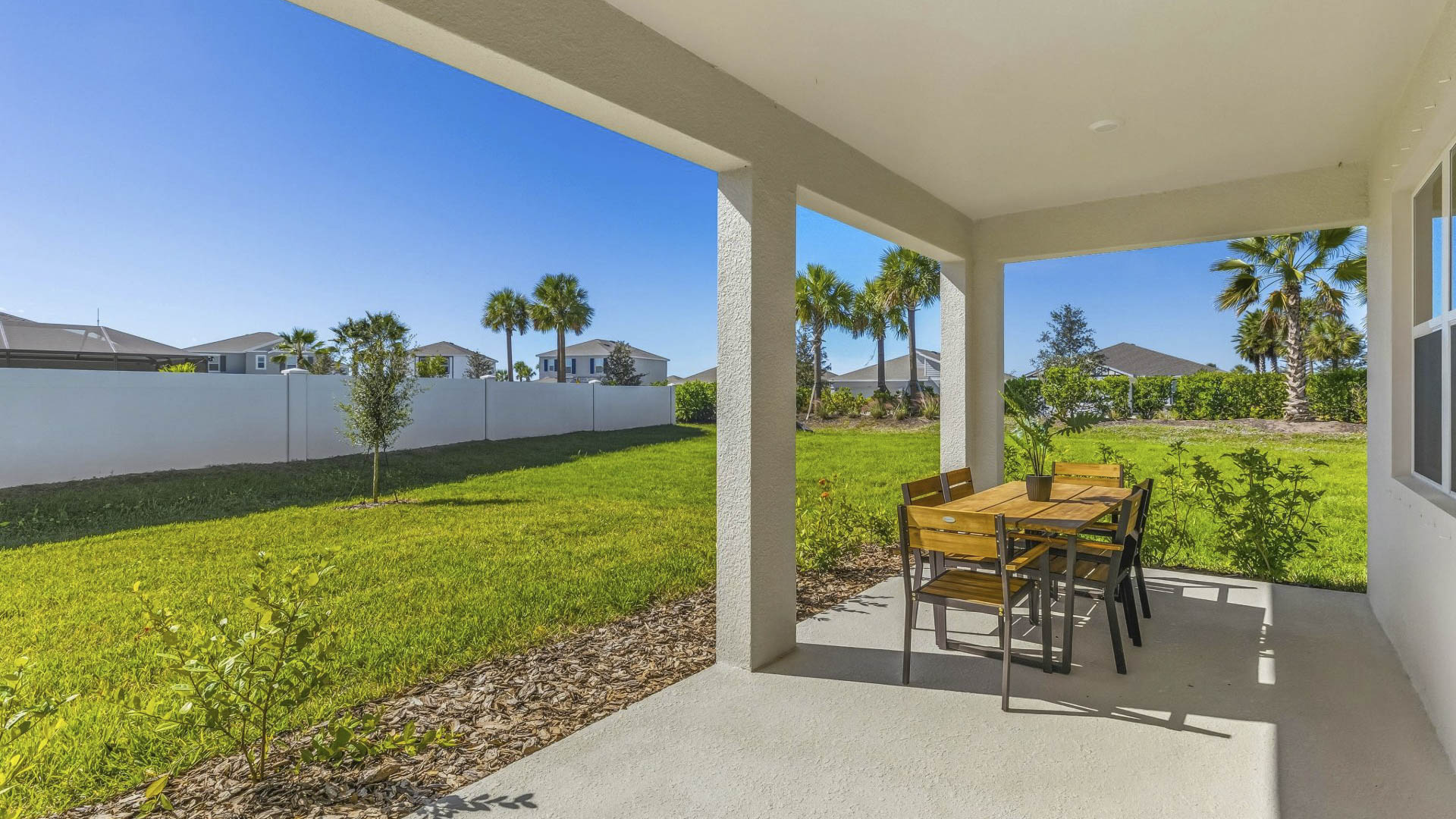 Covered patio in the Delray floorplan at Saddlestone by D.R. Horton in Lakewood Ranch Florida