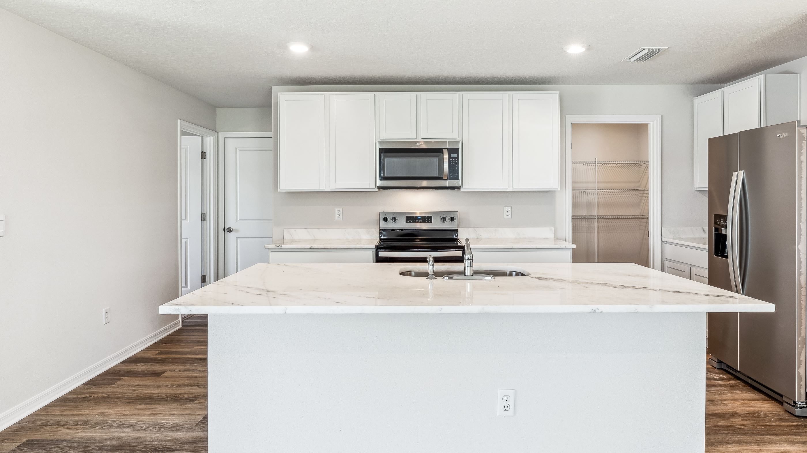 Kitchen in the Robie floorplan at Searie by D.R. Horton in Parrish Florida