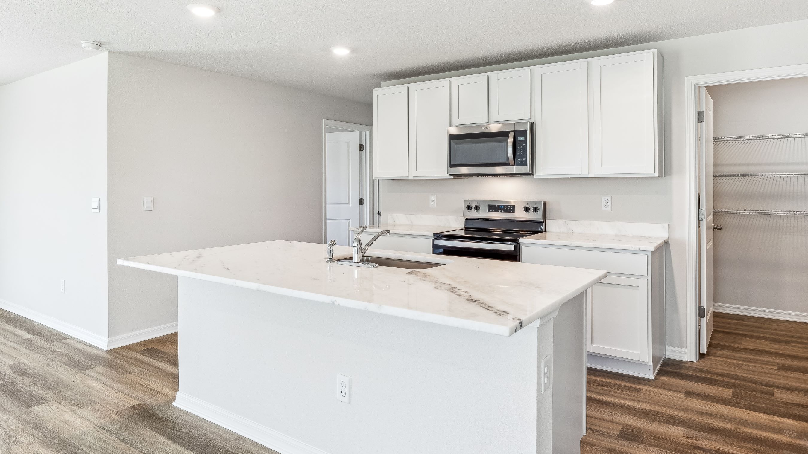 Kitchen in the Robie floorplan at Seaire by D.R. Horton in Parrish Florida