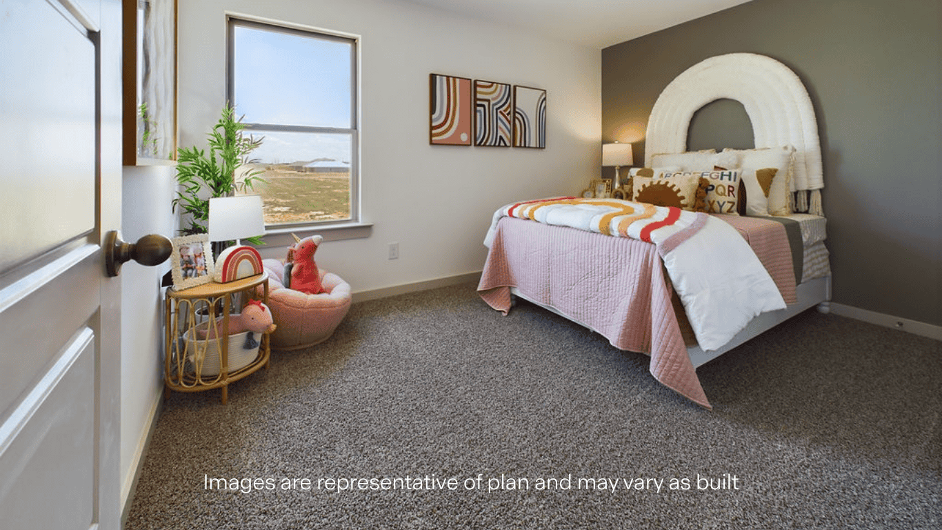 Guest bedroom with plush carpet and ample luighting