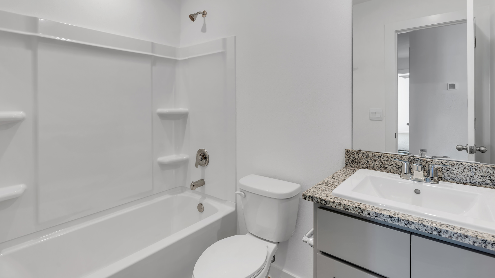 Guest bathroom located between guest bedrooms