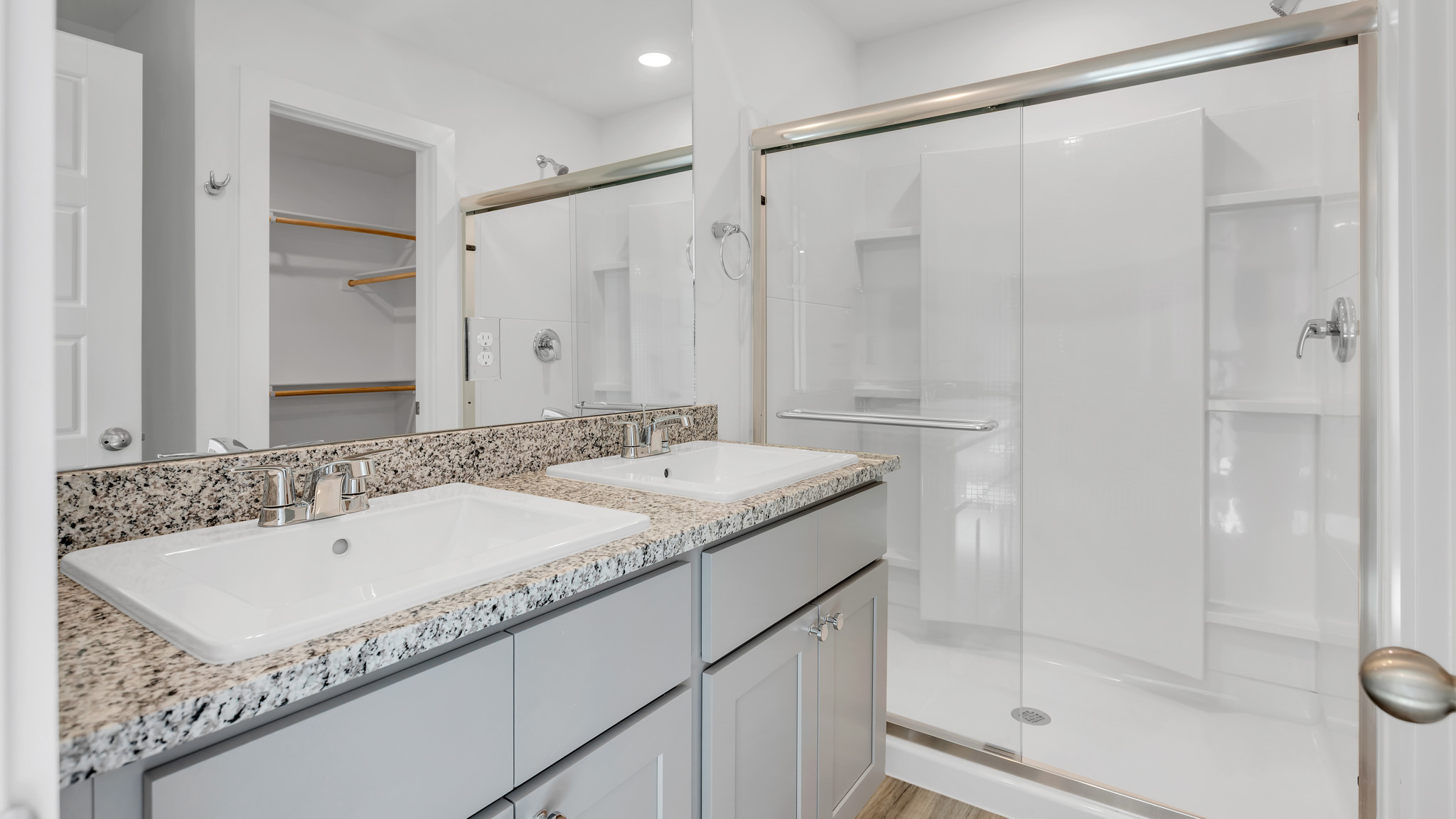 Primary bathroom with luxurious shower and built in vanity