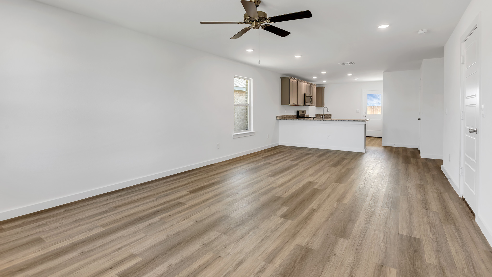 Open concept kitchen, living, family, and dining room space