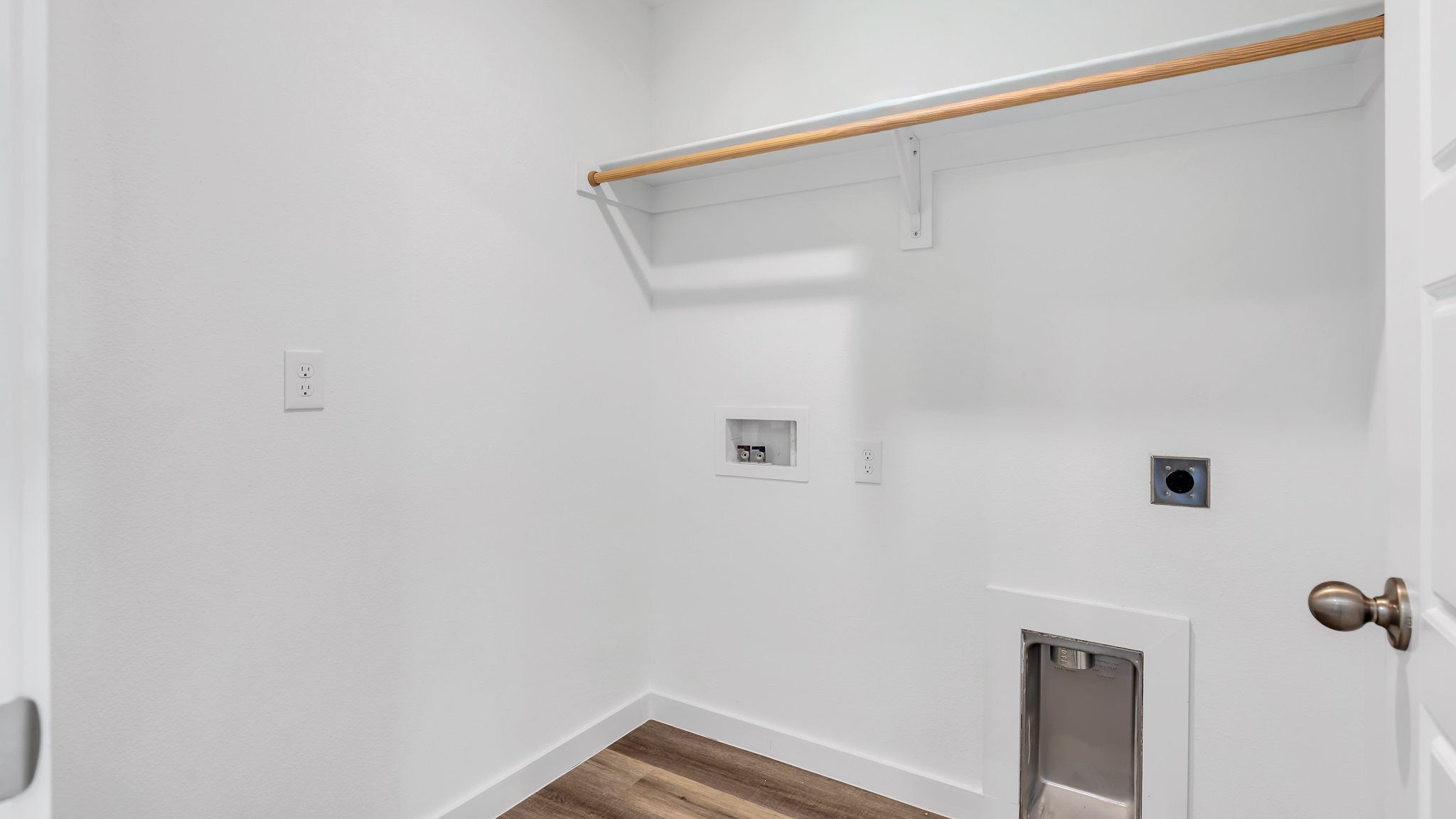 Laundry room and utility closet space with extra storage