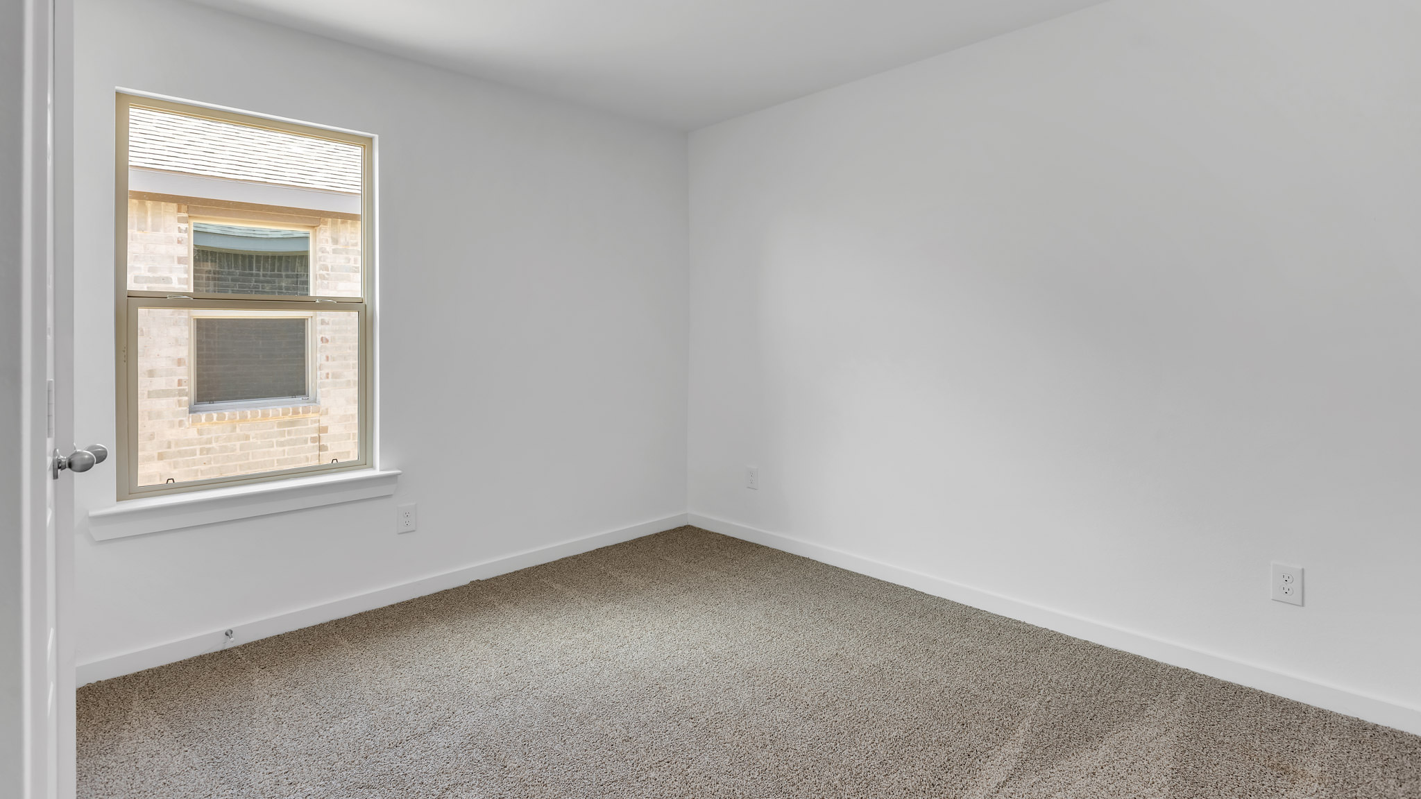 Guest bedroom 3 with side window and plush carpet floor
