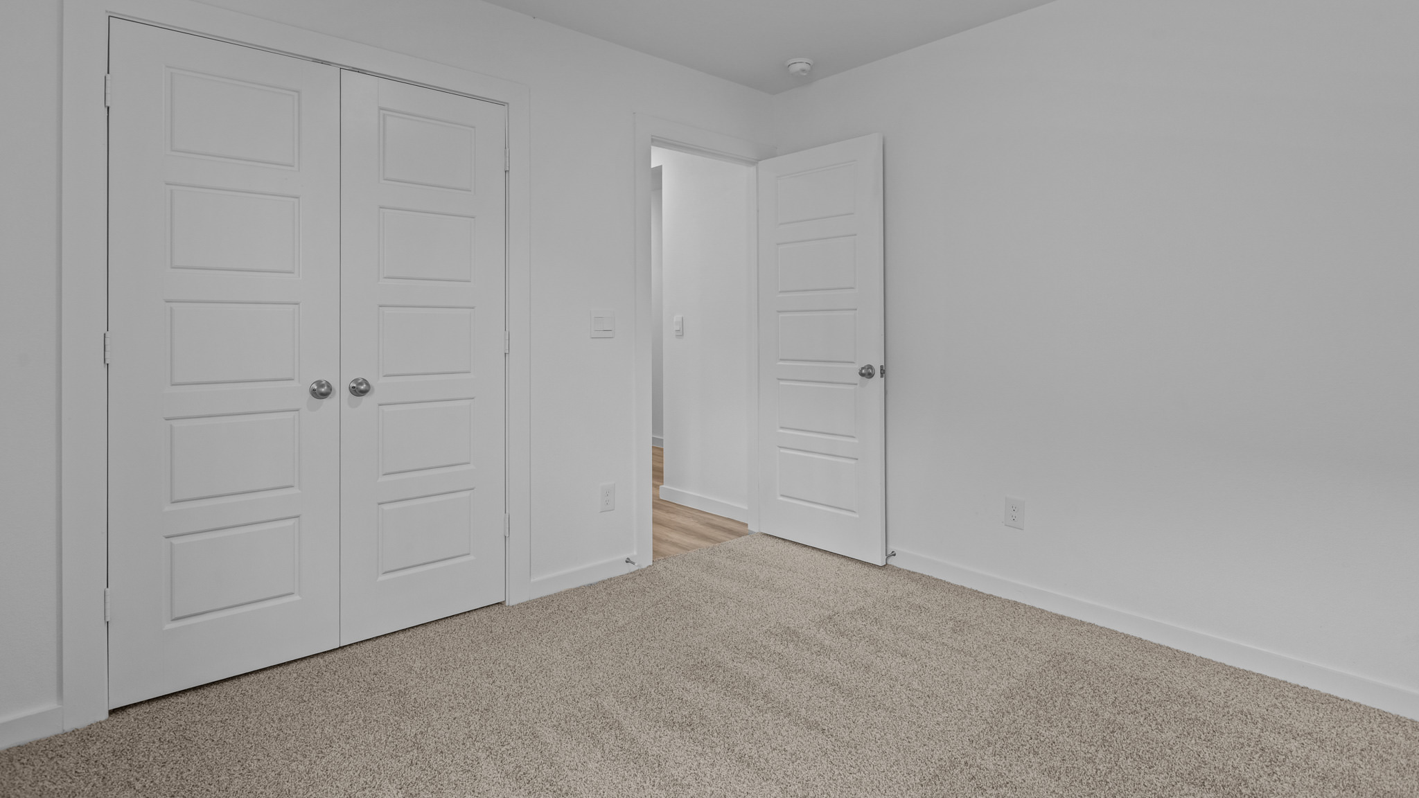 Guest bedroom 3 with plush carpet floors and spacious closet