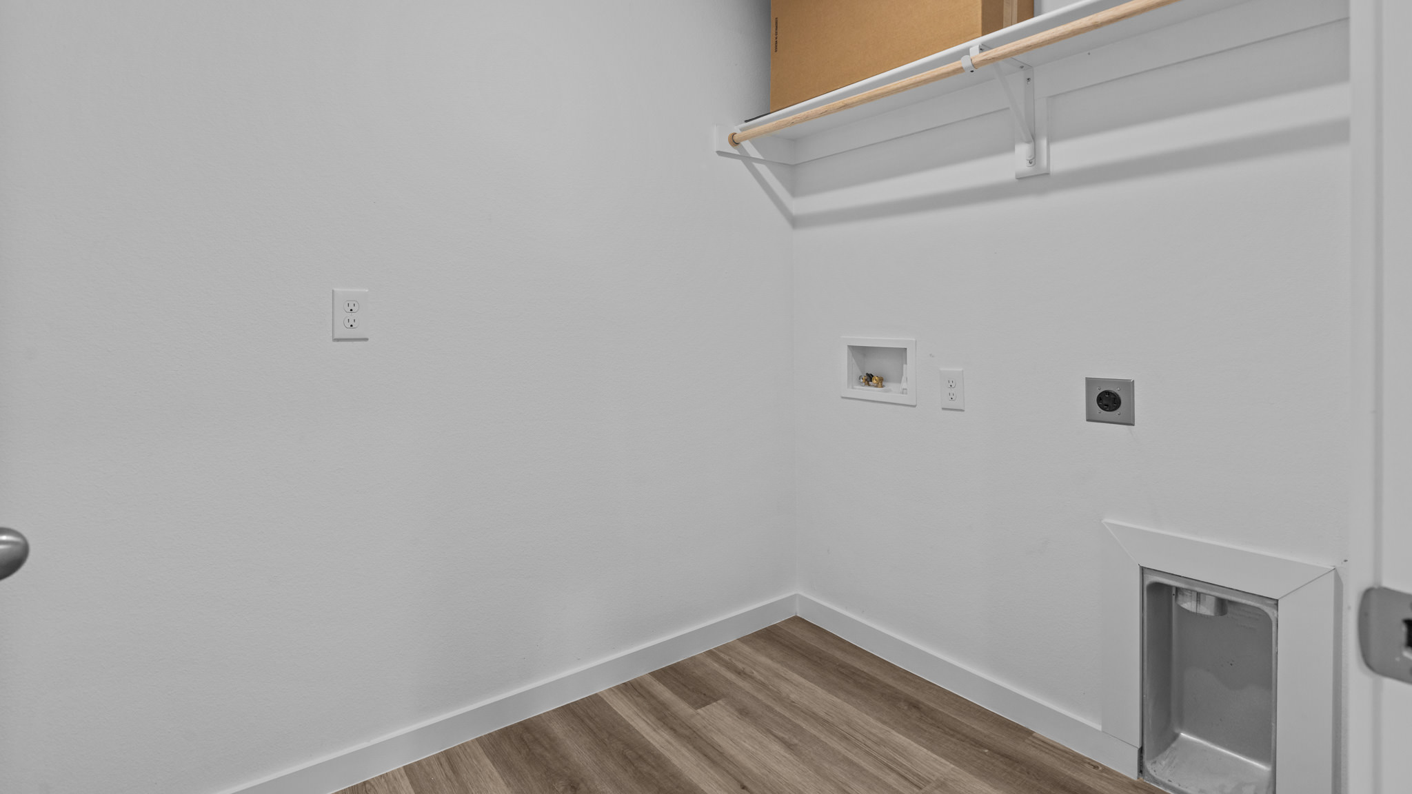 Laundry room and utility closet space with extra storage