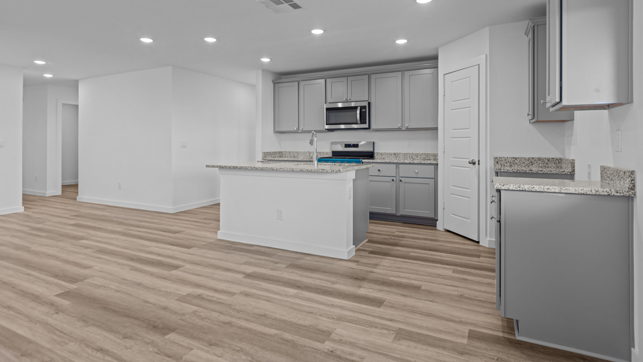 Spacious open kitchen overlooking family and living space