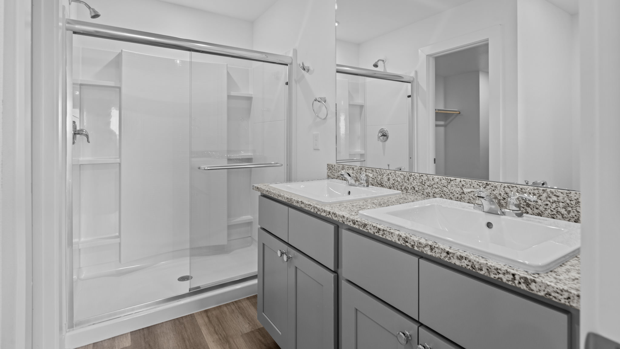 Private attached primary bathroom with built in vanity