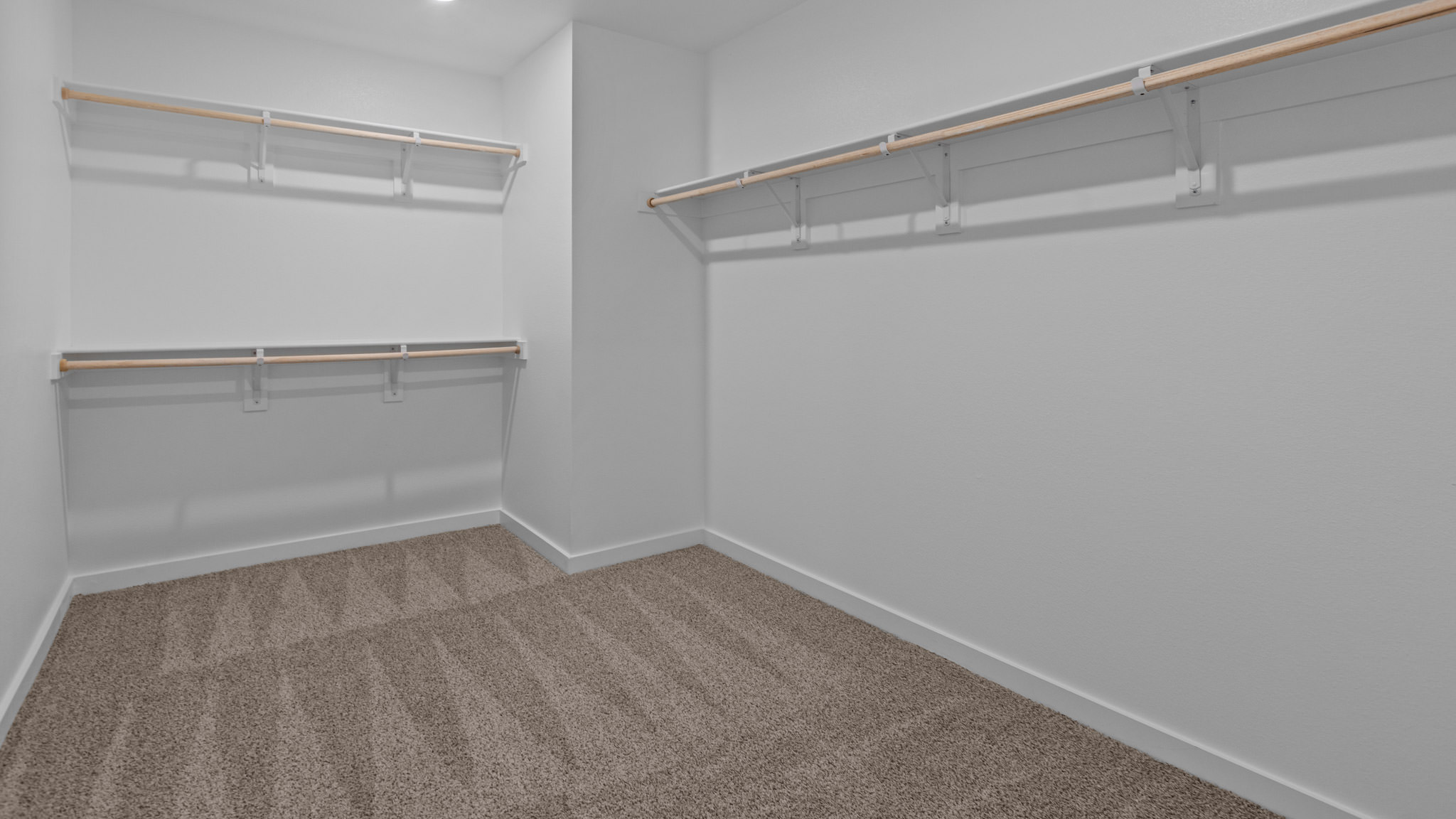 Primary walk-in closet with extra storage space