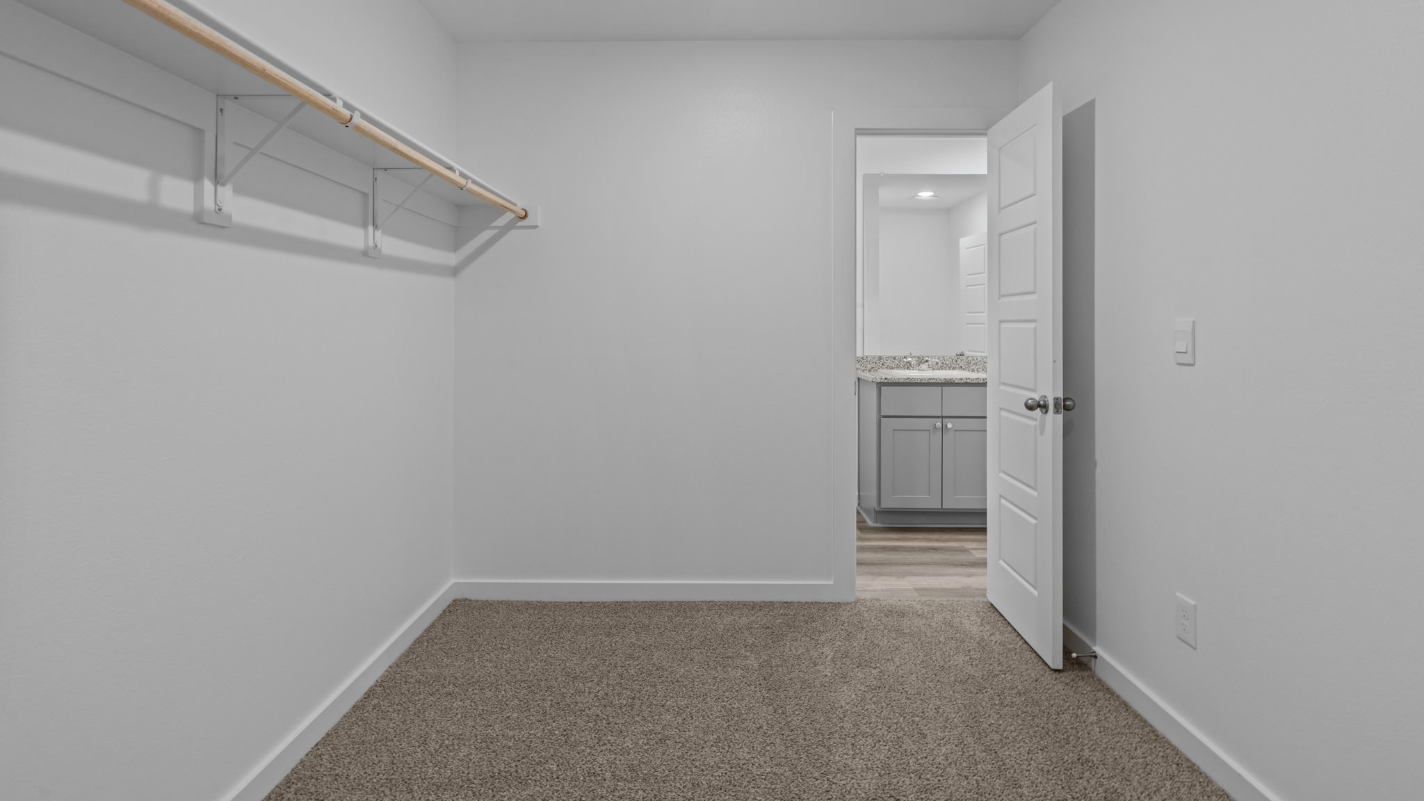 Primary walk-in closet with extra storage space