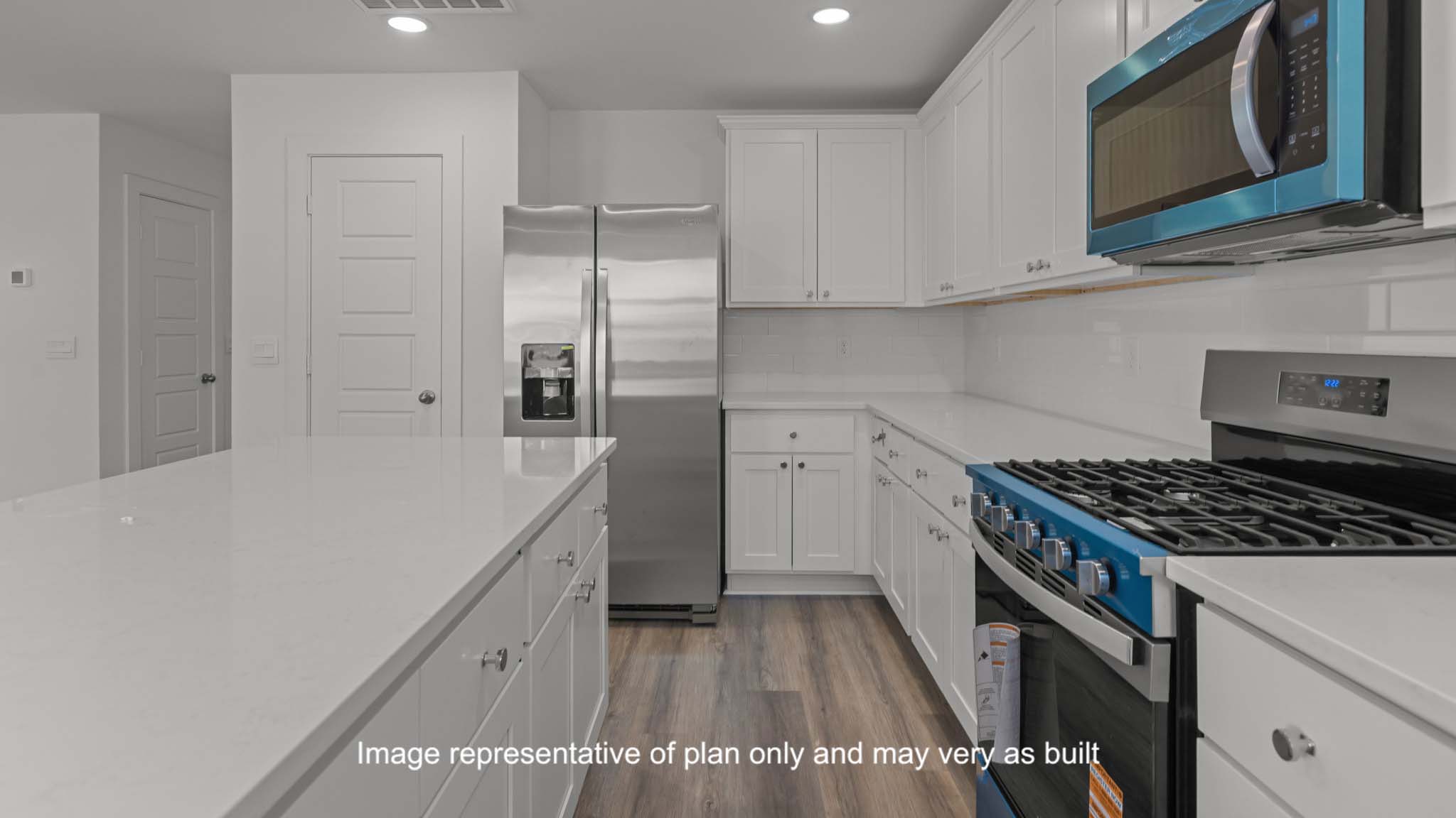 Spacious open concept kitchen with island and counter prep space