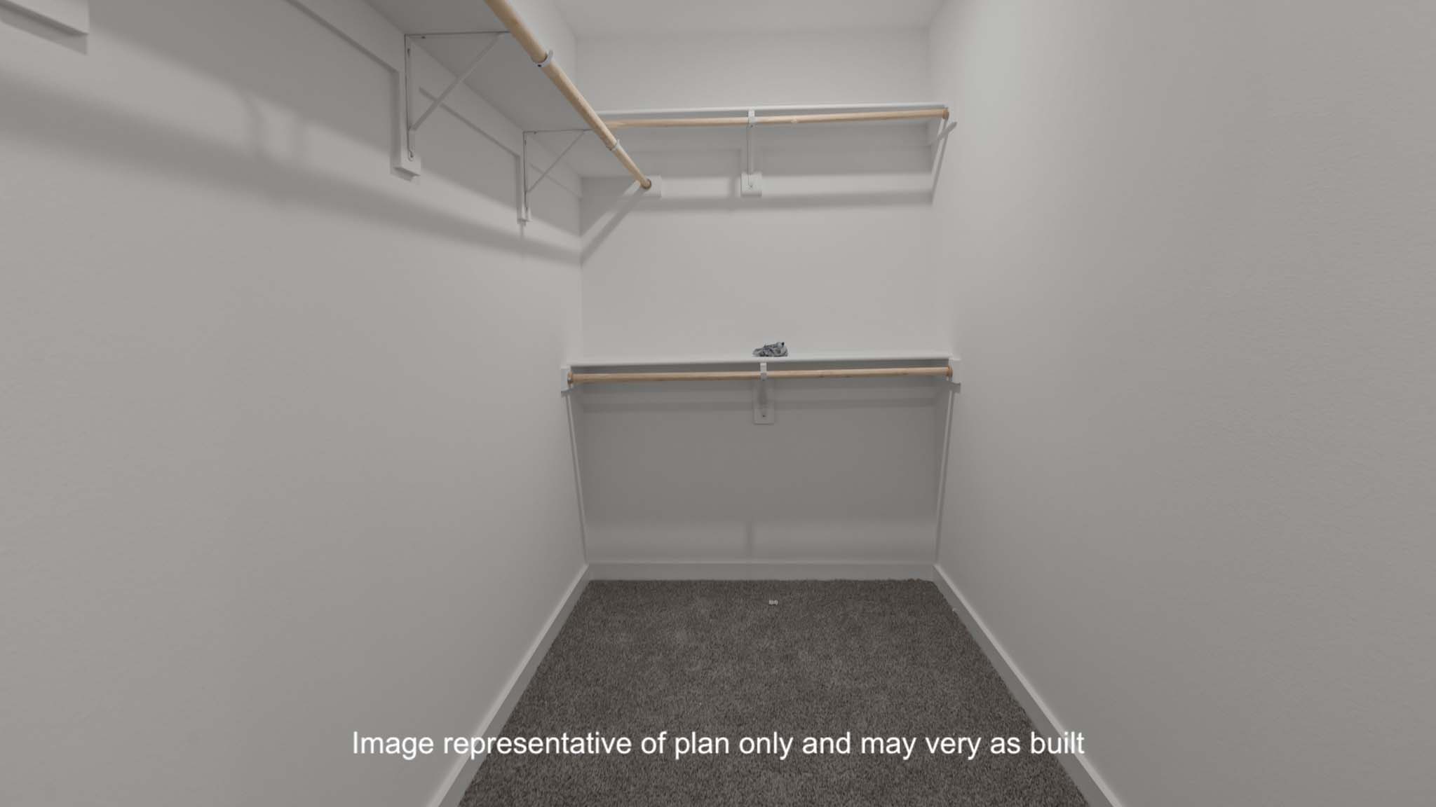 Primary walk-in closet with extra storage space
