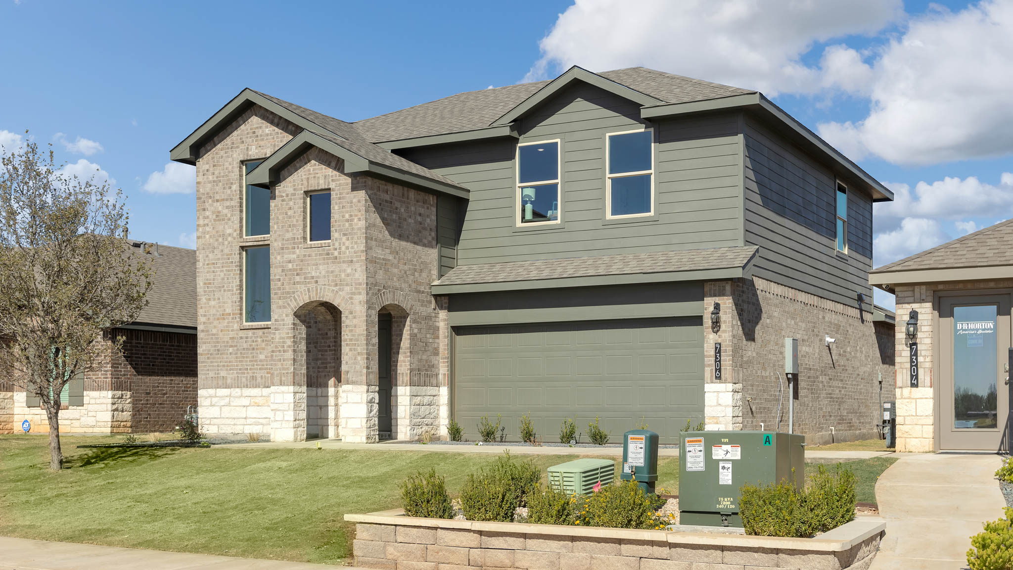 Side view of two story classic brick home