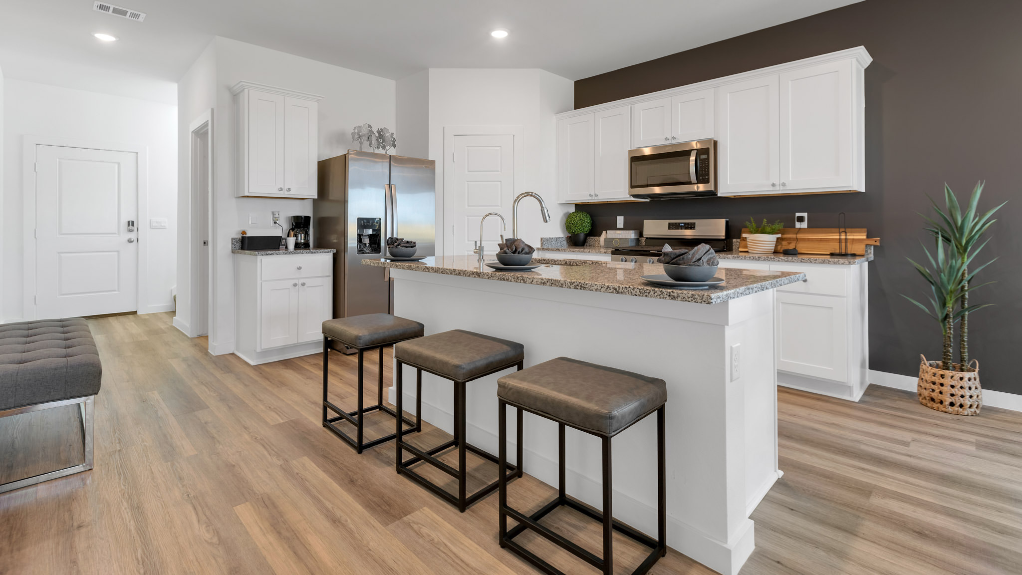 Spacious open concept kitchen with island and counter prep space