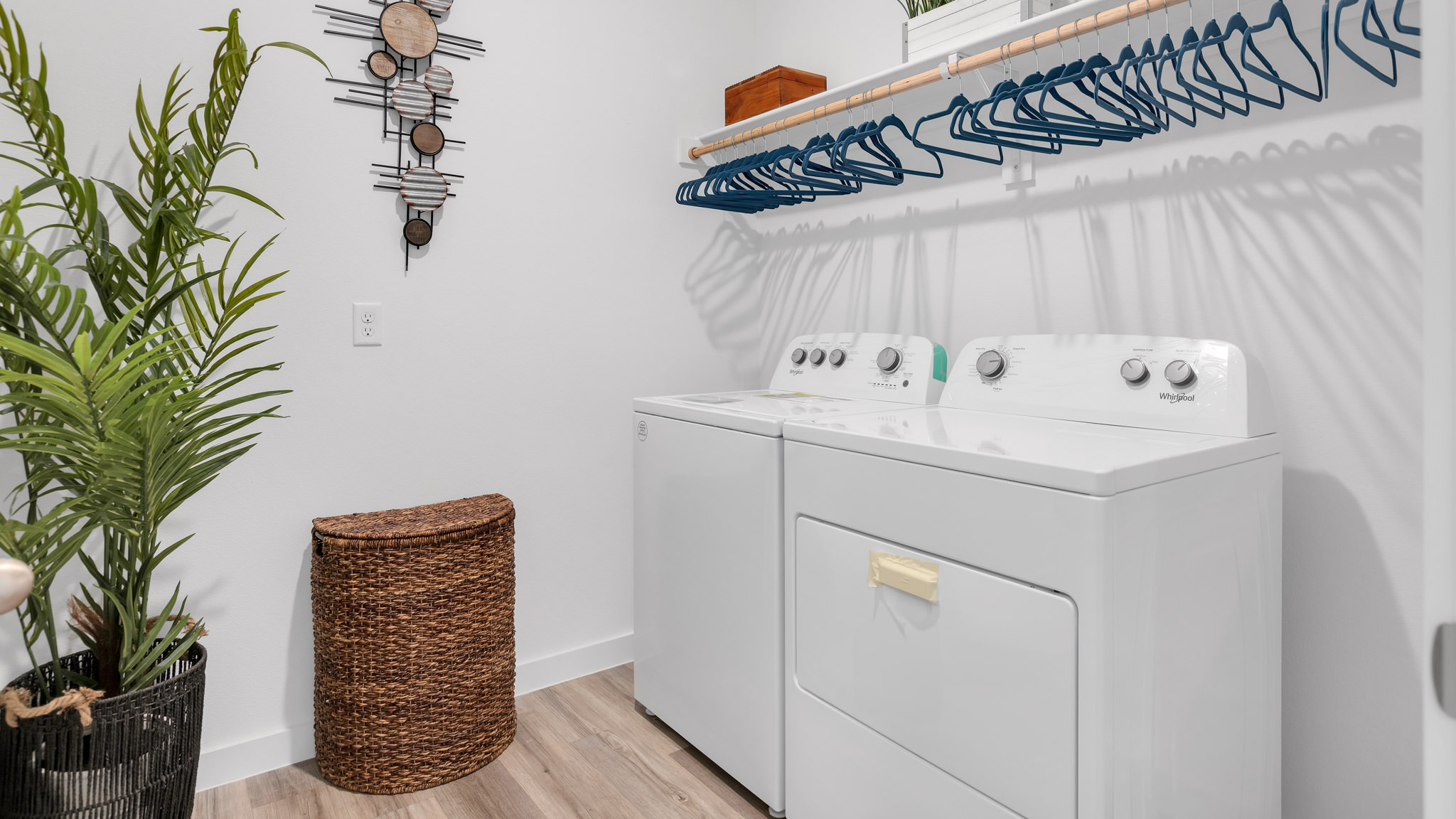 Laundry room and utility closet space with extra storage