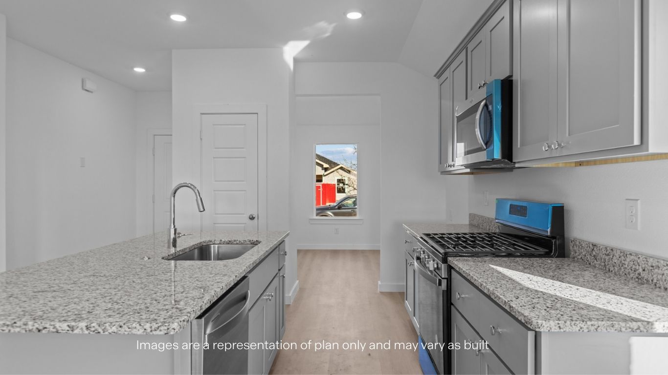 Open concept kitchen with stainless steel appliances, shaker style cabinets, and elevated finishes