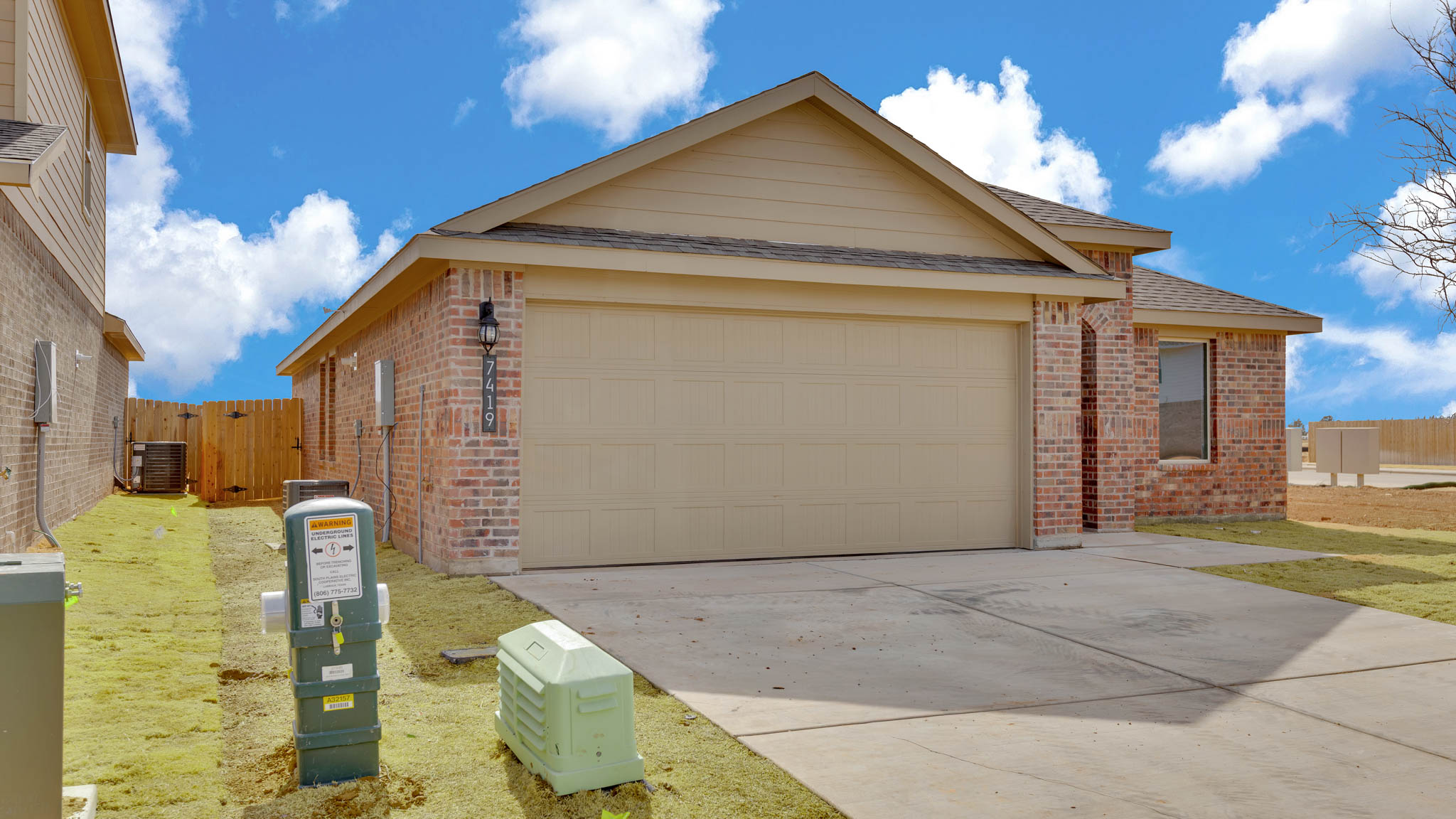Side view of single story timeless brick home