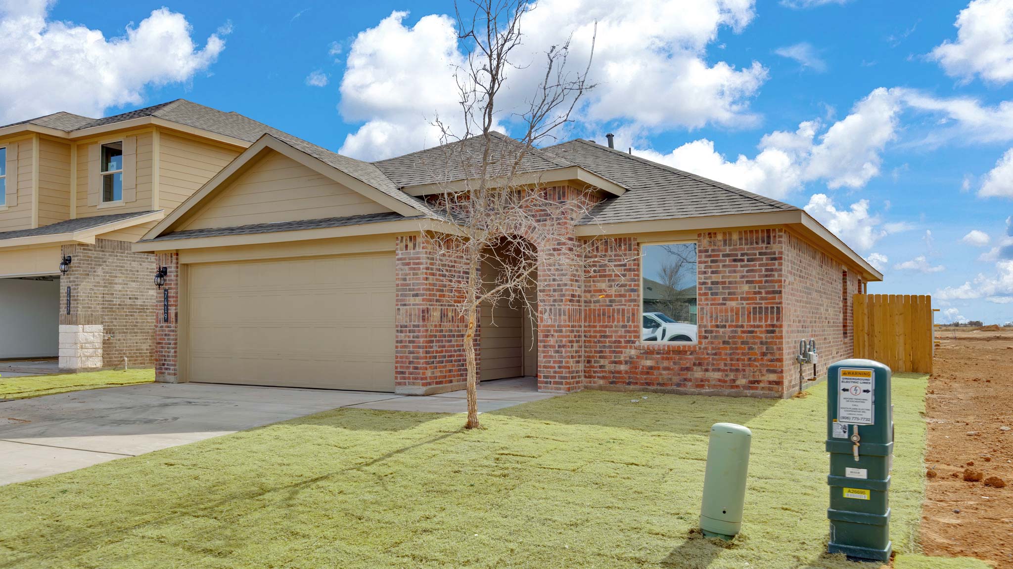 Side view of single story timeless brick home