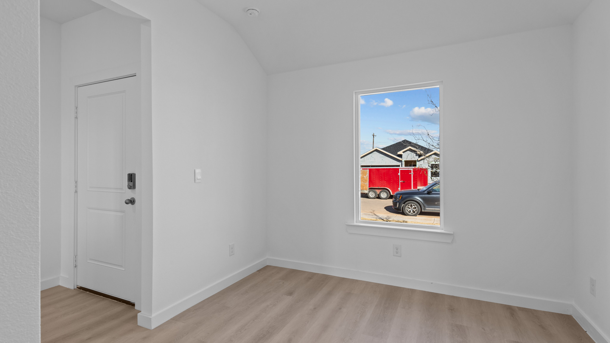 Dining area with white interior, window and vinyl plank flooring