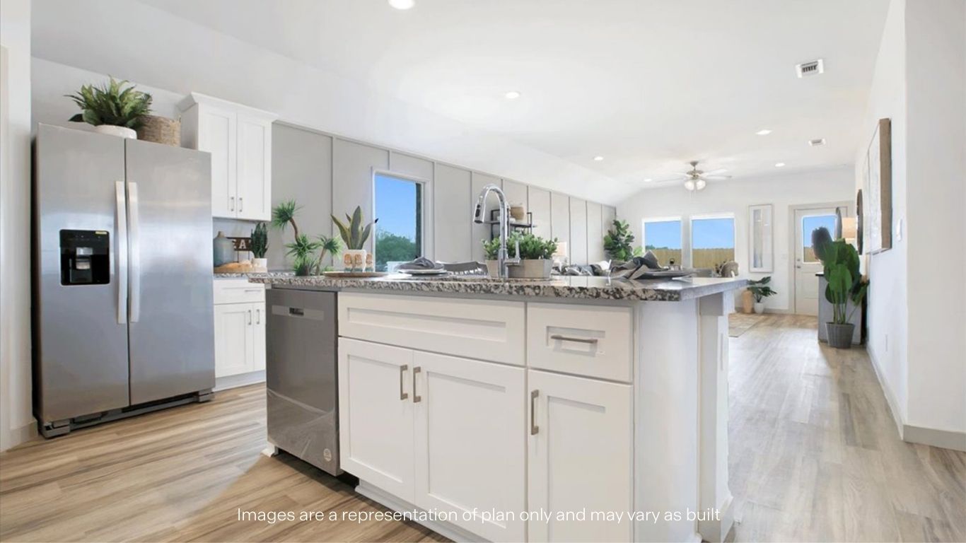 Open concept kitchen with stainless steel appliances, shaker style cabinets, and elevated finishes