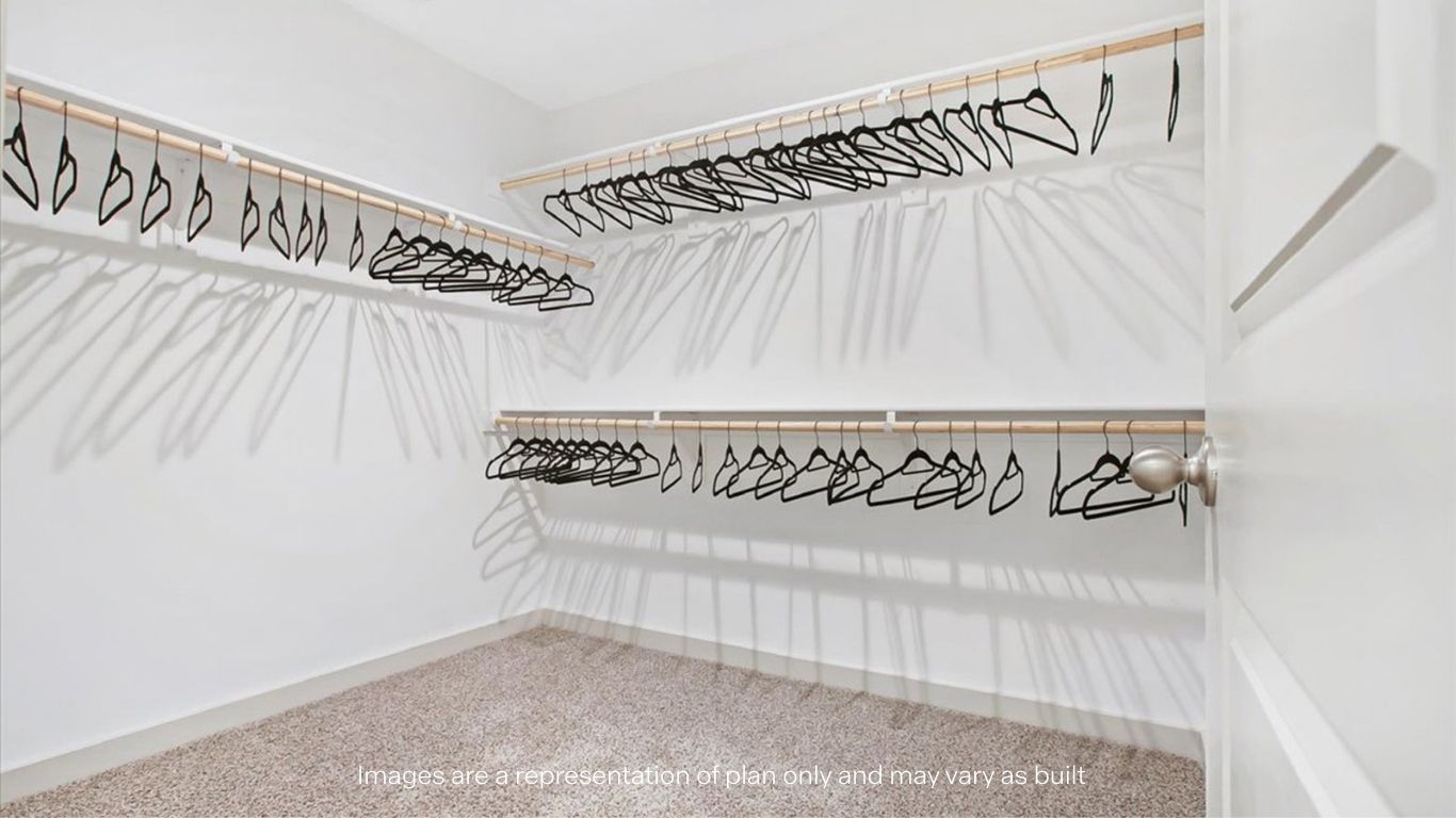 Primary walk-in closet with extra storage space