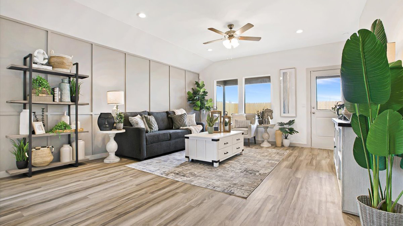 Spacious family area with windows overlooking backyard