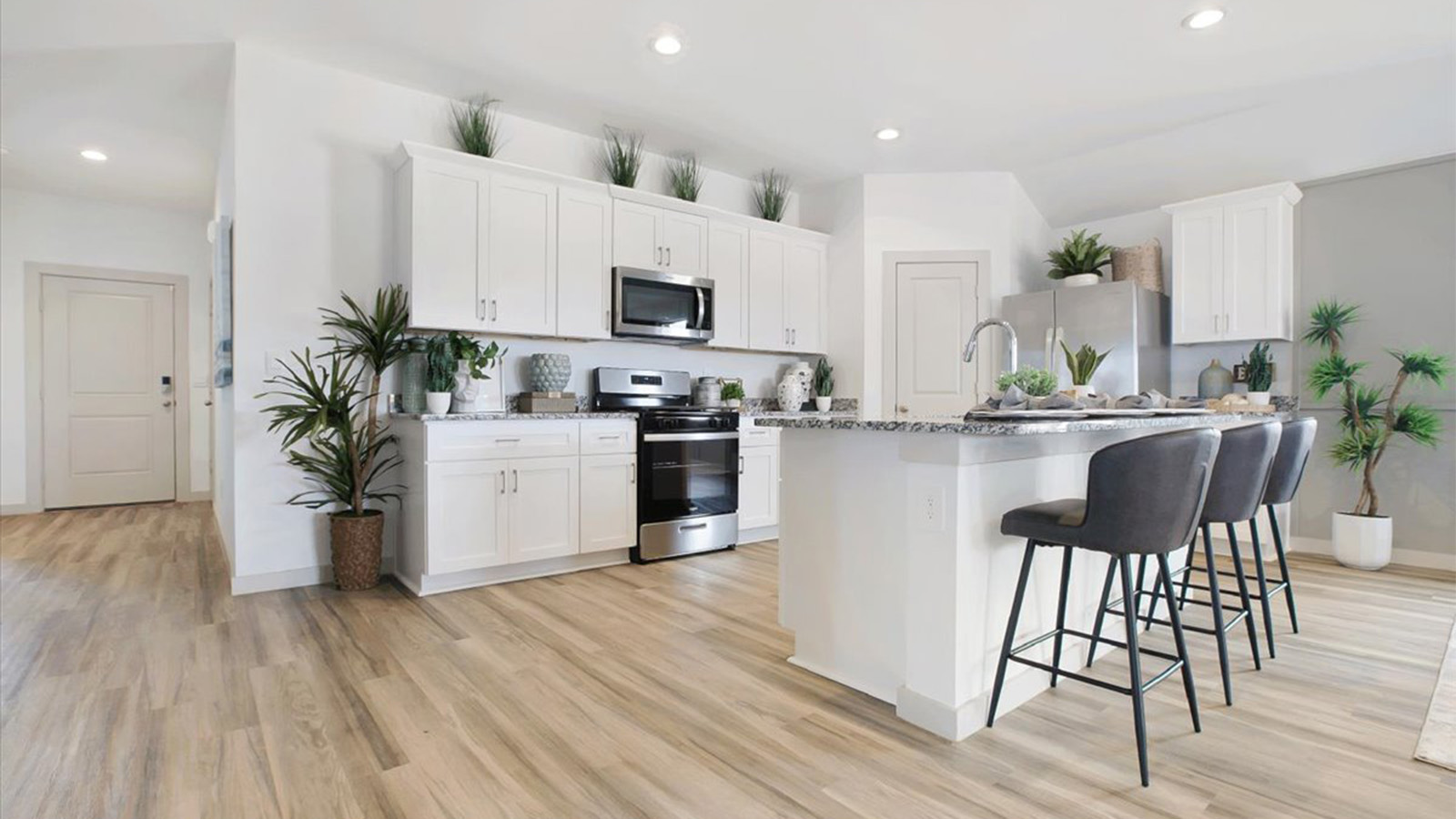 Open kitchen concept with stainless steel appliances