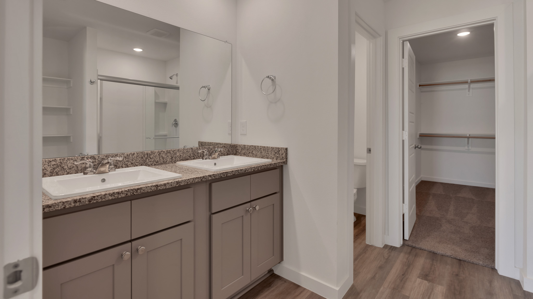 Primary bathroom with built in double sink vanity