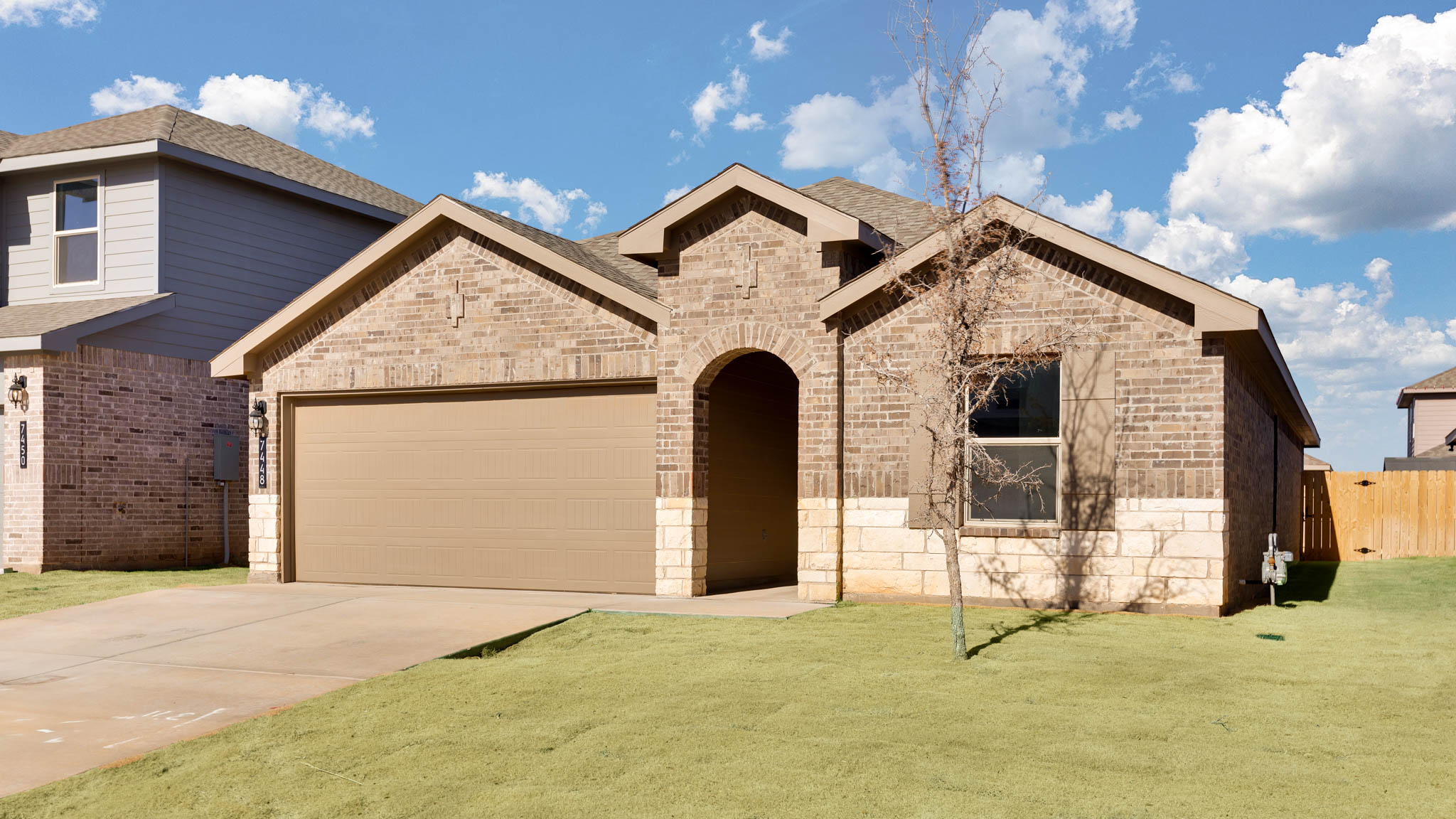 Side view of single story modern brick style home