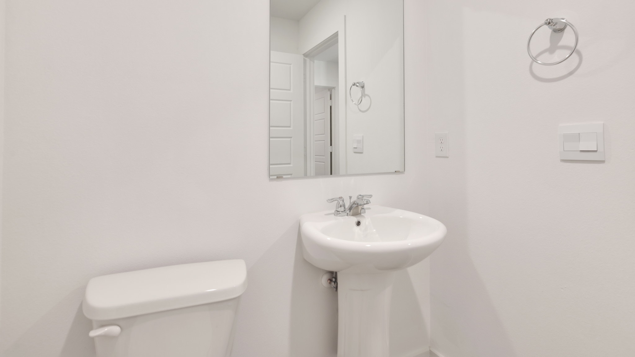 Half bath located before entering kitchen area